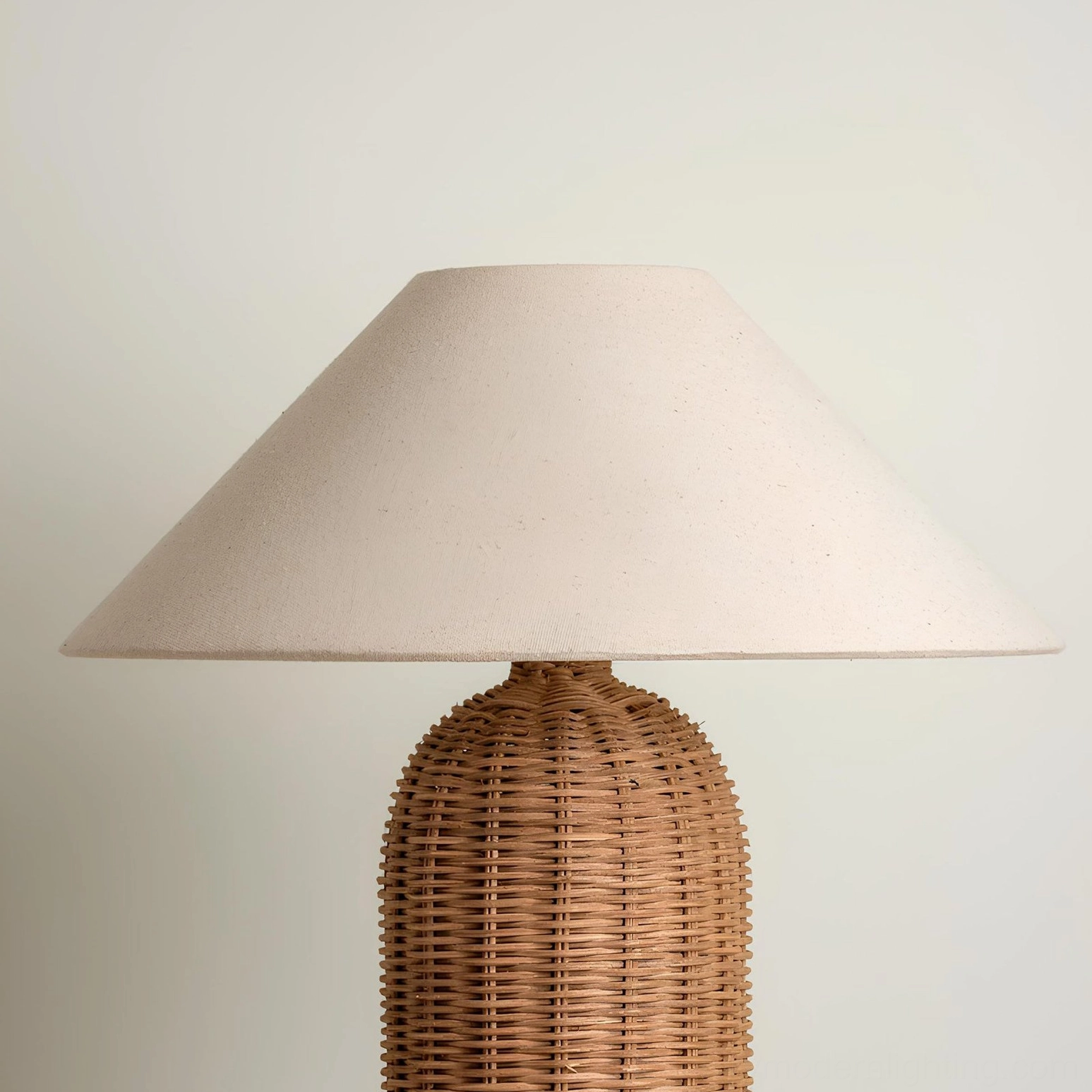 Stellan handwoven rattan table lamp paired with natural fiber accessories and botanical décor styling