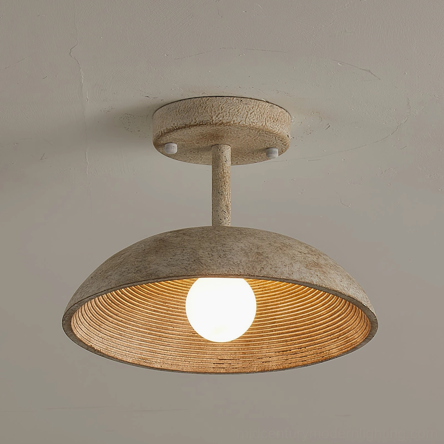 Side profile of Stevie semi-flush ceiling light showing short mounting stem and weathered beige exterior finish