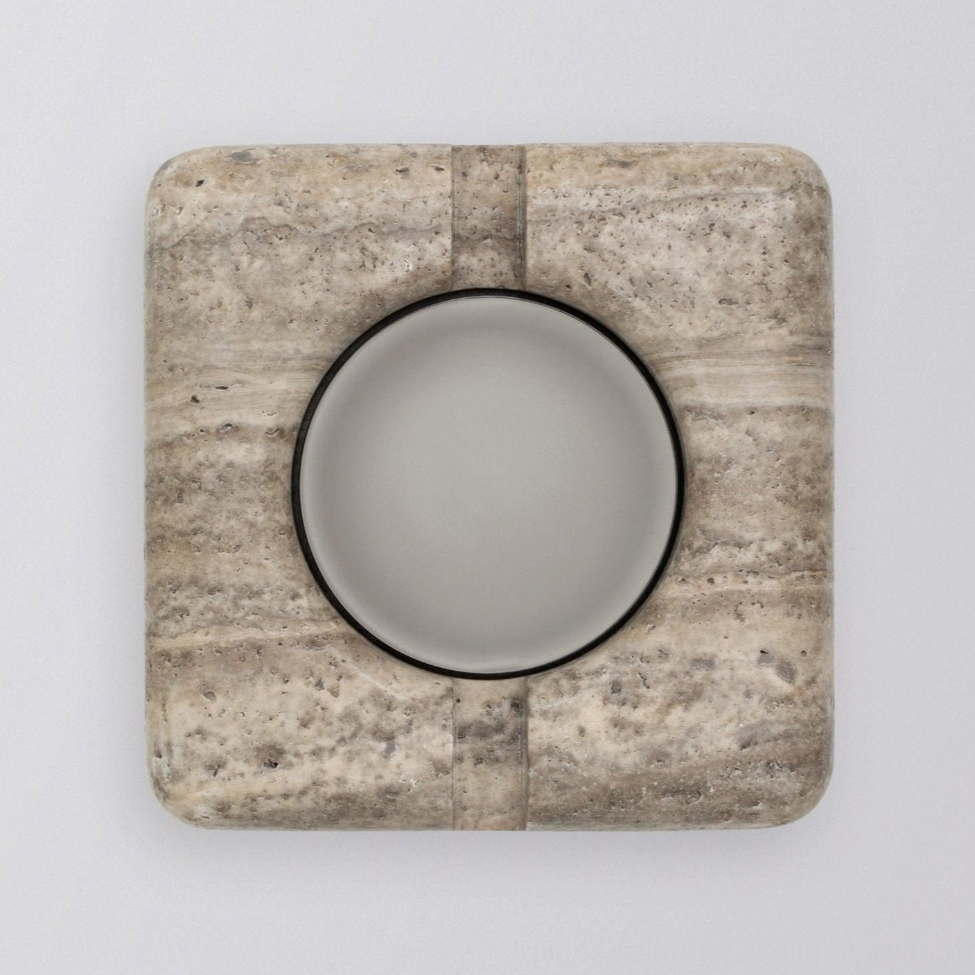 Natural stone wall lamp detail showing polished surface finish and material craftsmanship
