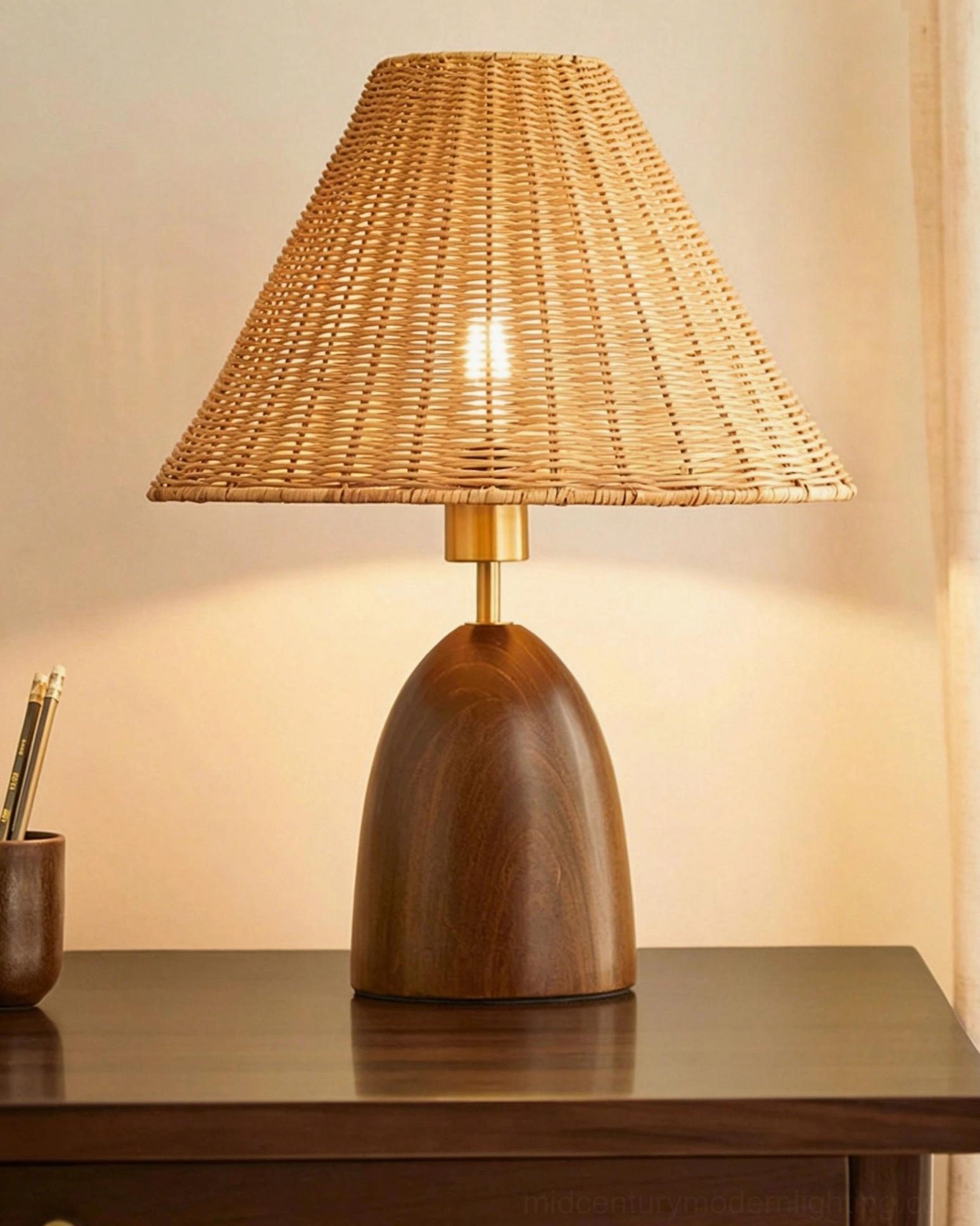 Suri rattan table lamp with natural woven rattan shade and walnut wood base on white background, neutral tone design