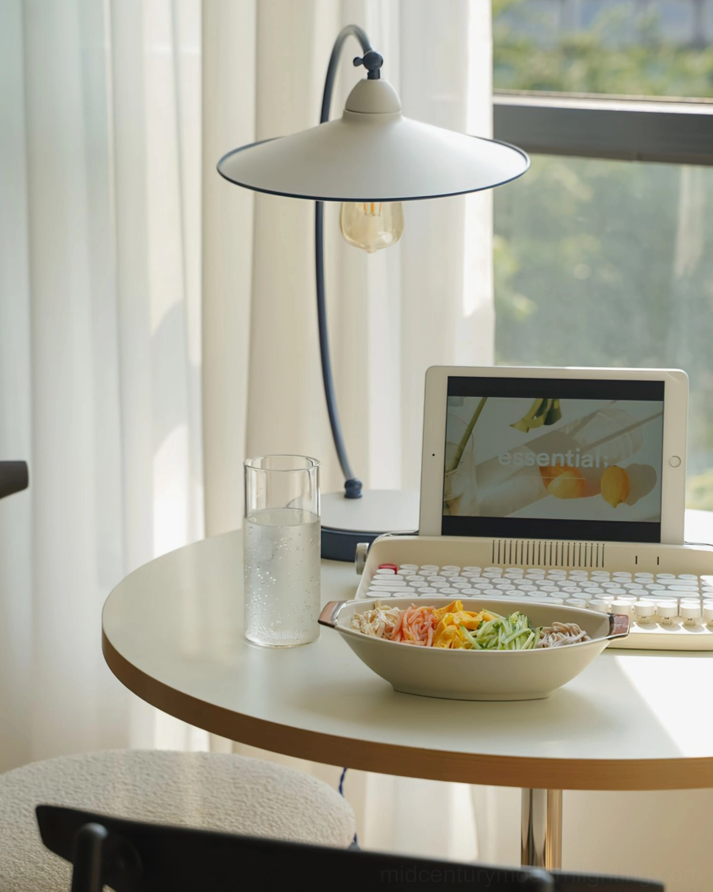 Swan Blue Table Lamp on bay window dining table - side view with laptop and meal setup