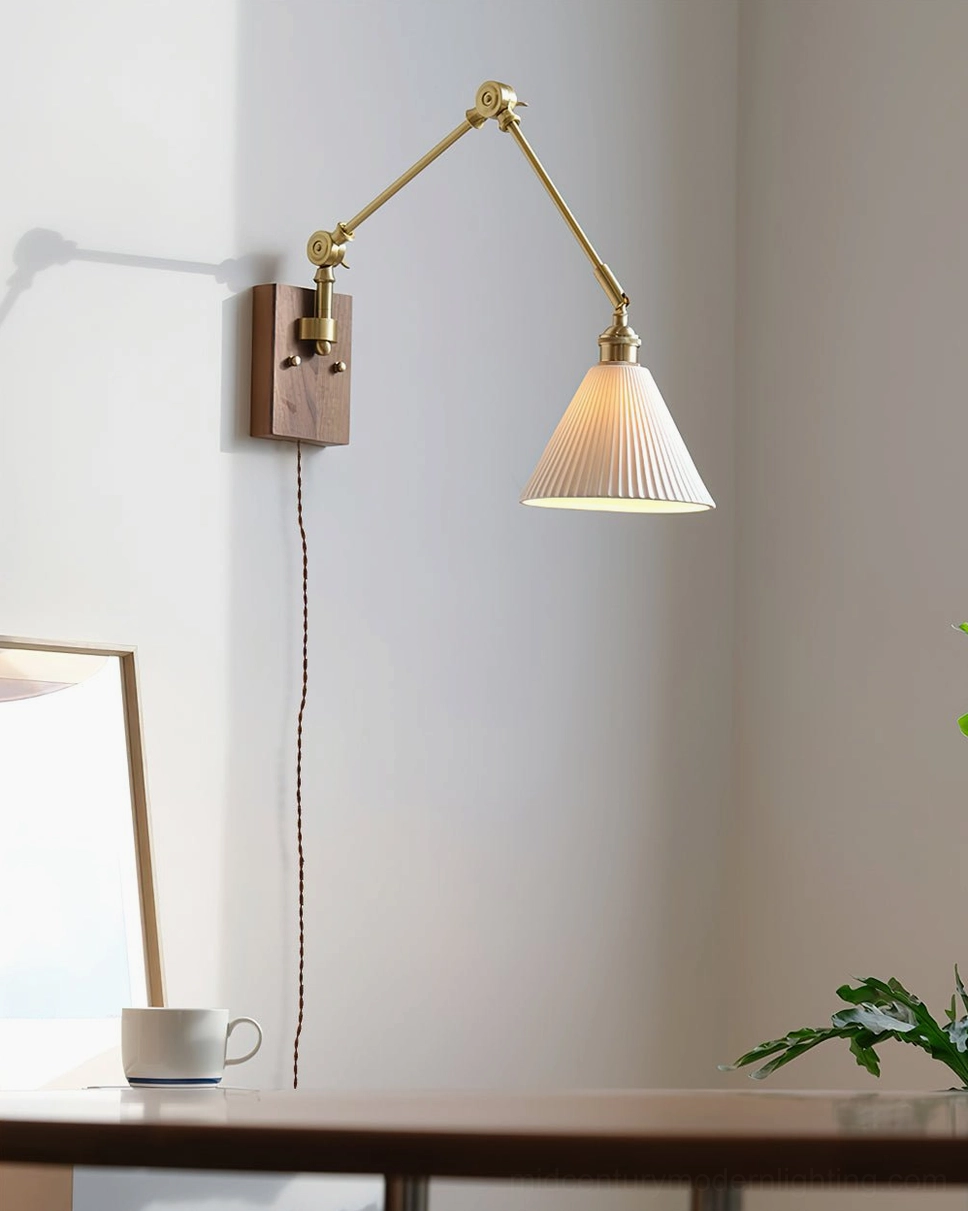 Swing arm wall lamp over dining area showing ribbed ceramic shade and adjustable arm mechanism