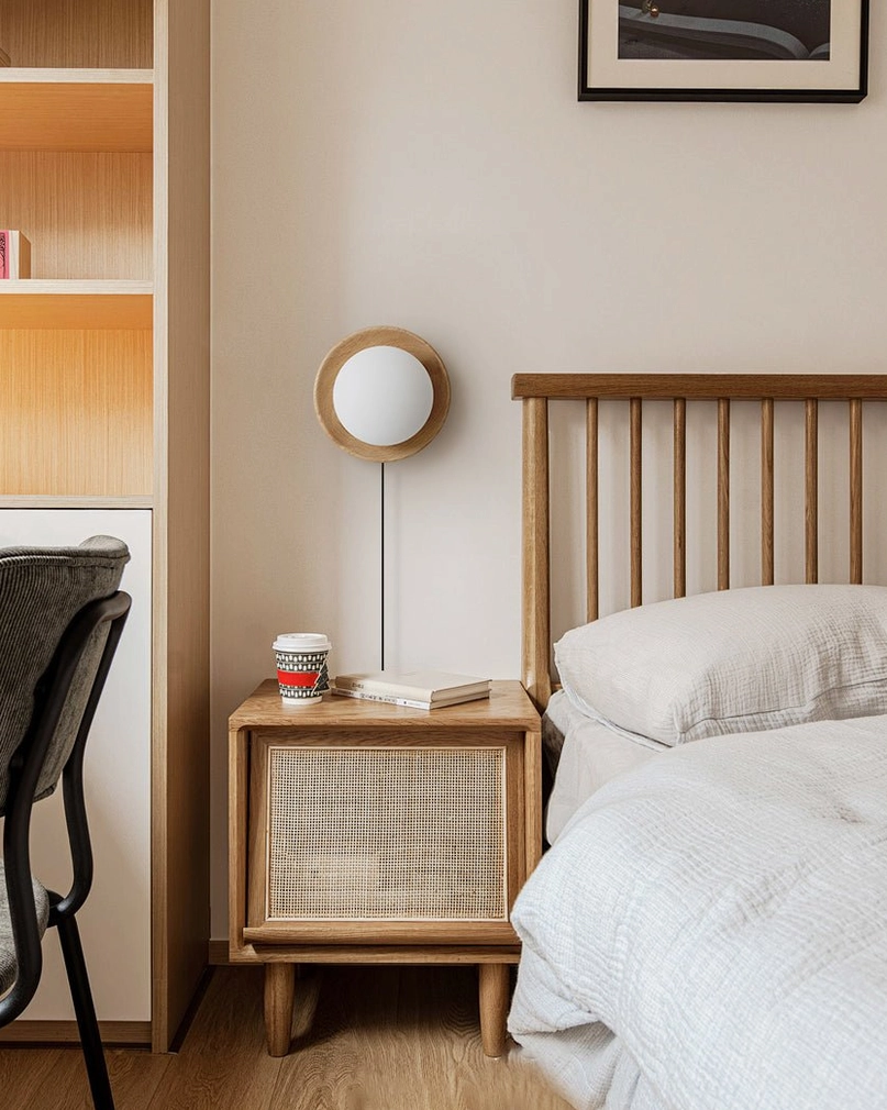 Tablet wall-mounted plug-in lamp showing clean contemporary design with wooden backing and integrated LED globe