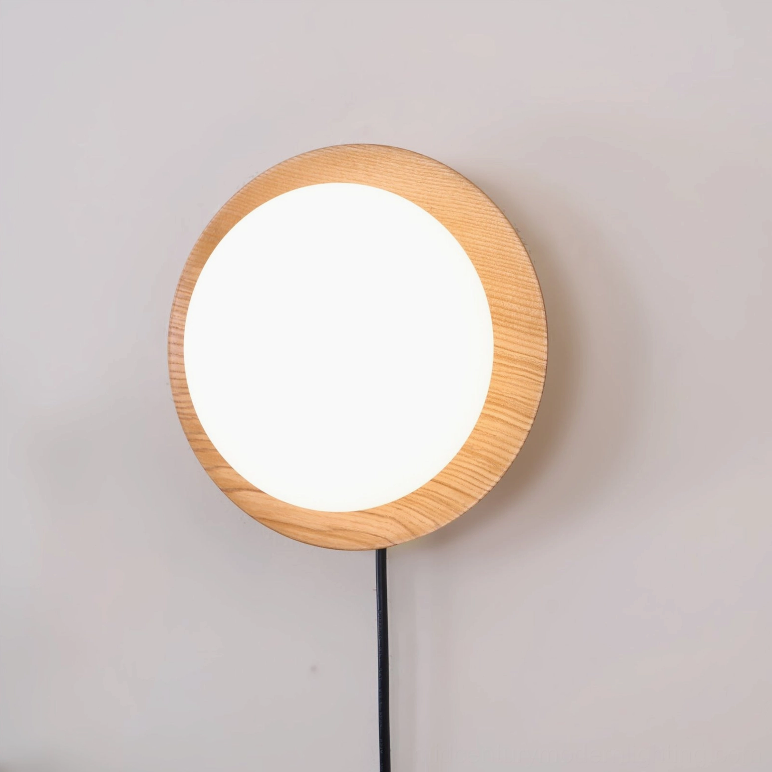 Tablet wooden wall lamp mounted on wall with natural diffused light showing integrated LED technology and minimalist design