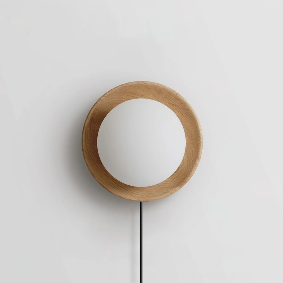Plug-in Tablet wall lamp showing wood backing plate and frosted glass sphere design in Scandinavian minimalist style