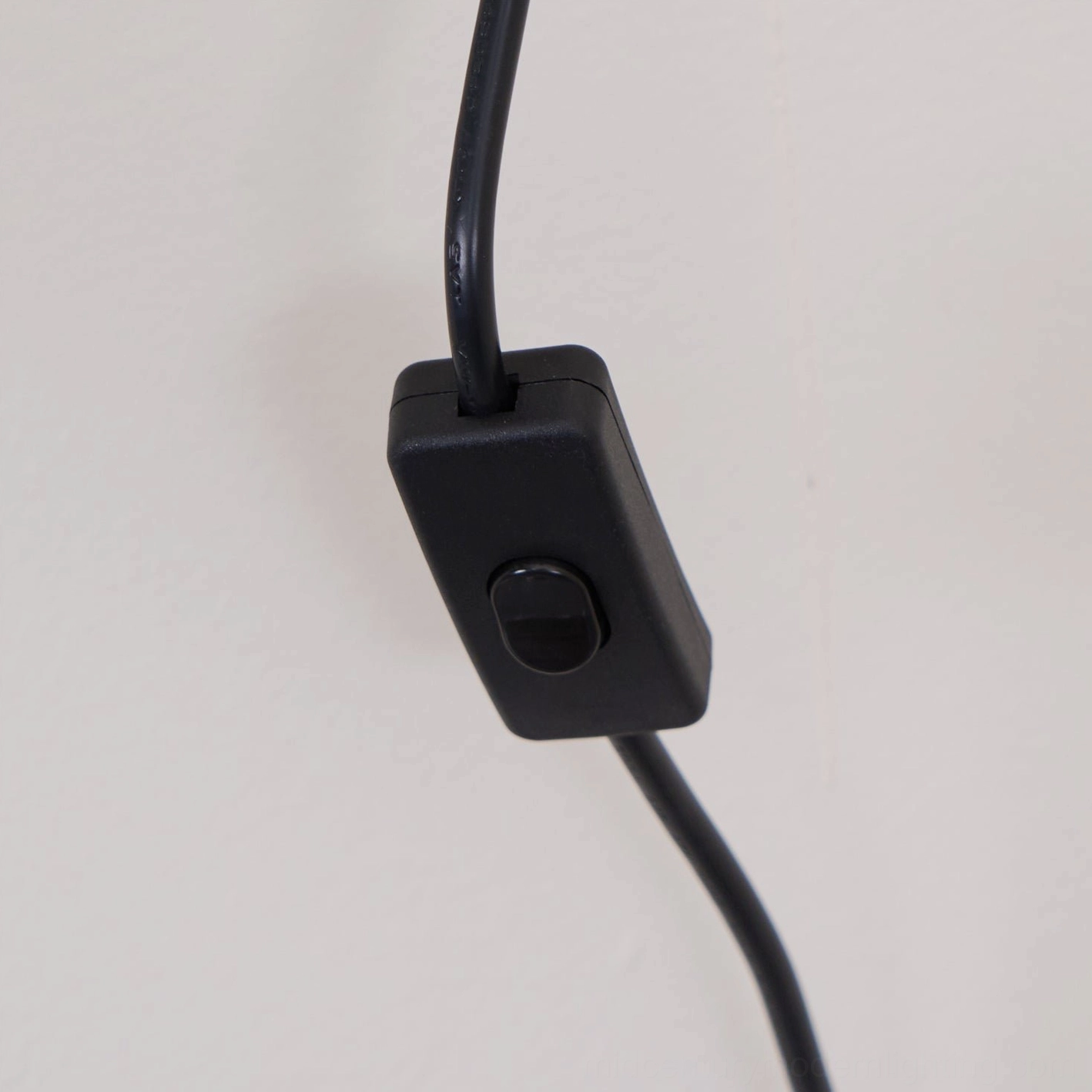 Tablet plug-in wall lamp with walnut finish wood backing plate and frosted glass globe in contemporary interior
