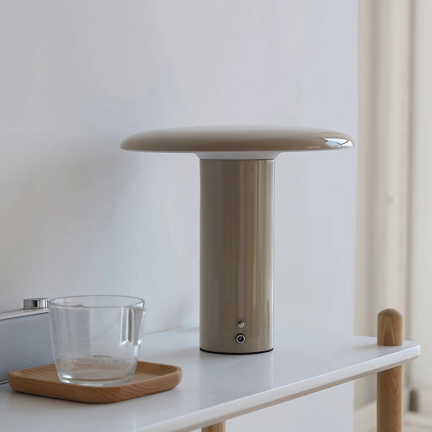 Takku taupe cordless mushroom lamp on minimalist home shelf with glass cup and wooden coaster styling