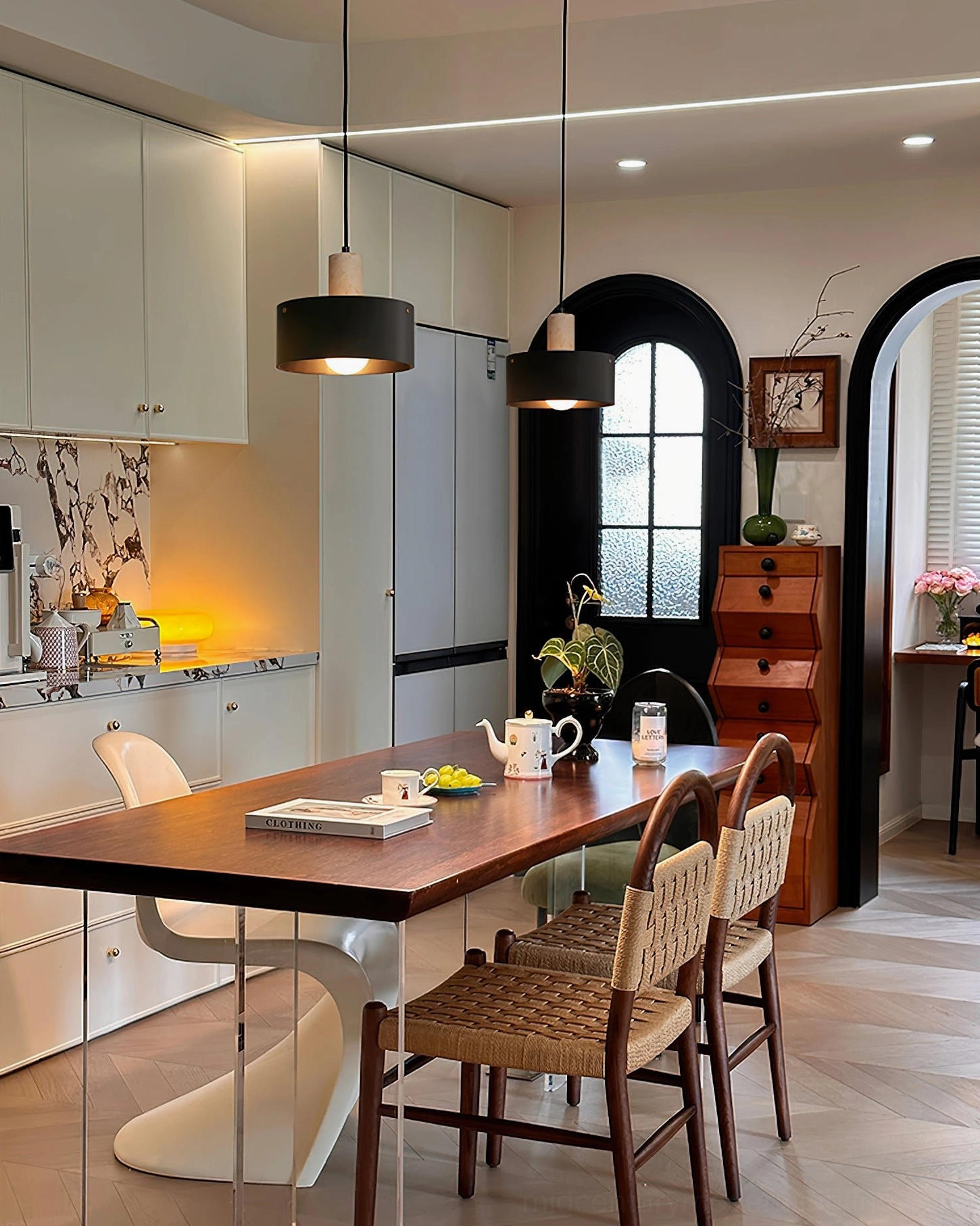 Two different Tako pendant lamp styles displayed in open-plan kitchen and dining room setting
