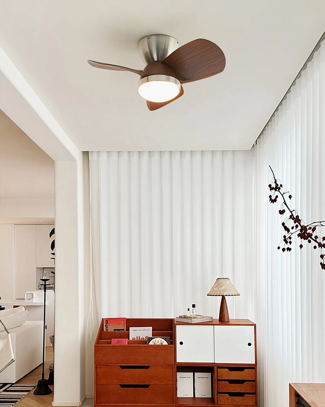 Talaya integrated LED ceiling fan in Scandinavian minimalist bedroom with sheer white curtains