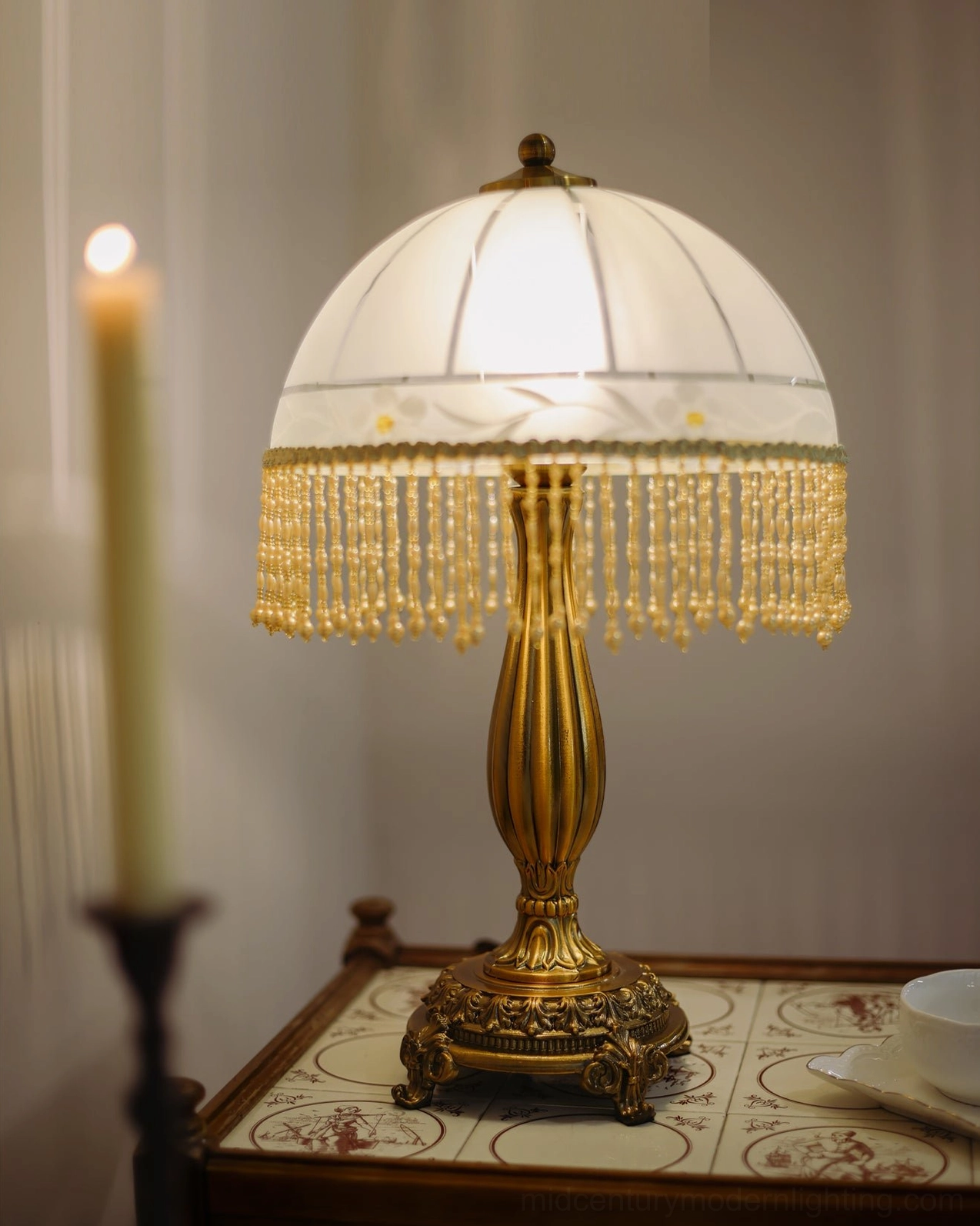 Brass tassel flower table lamp three-quarter angle showing base construction and frosted glass shade design