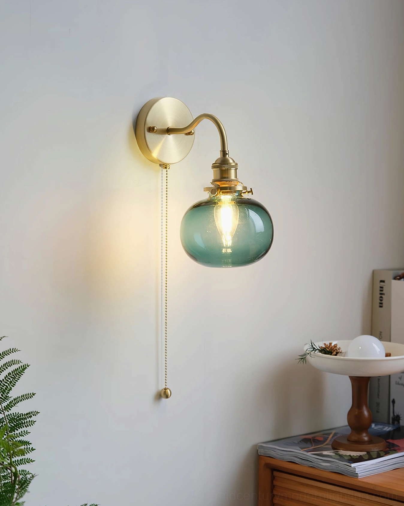 Teal green glass brass wall sconce in minimalist Nordic interior space - contemporary mid-century design