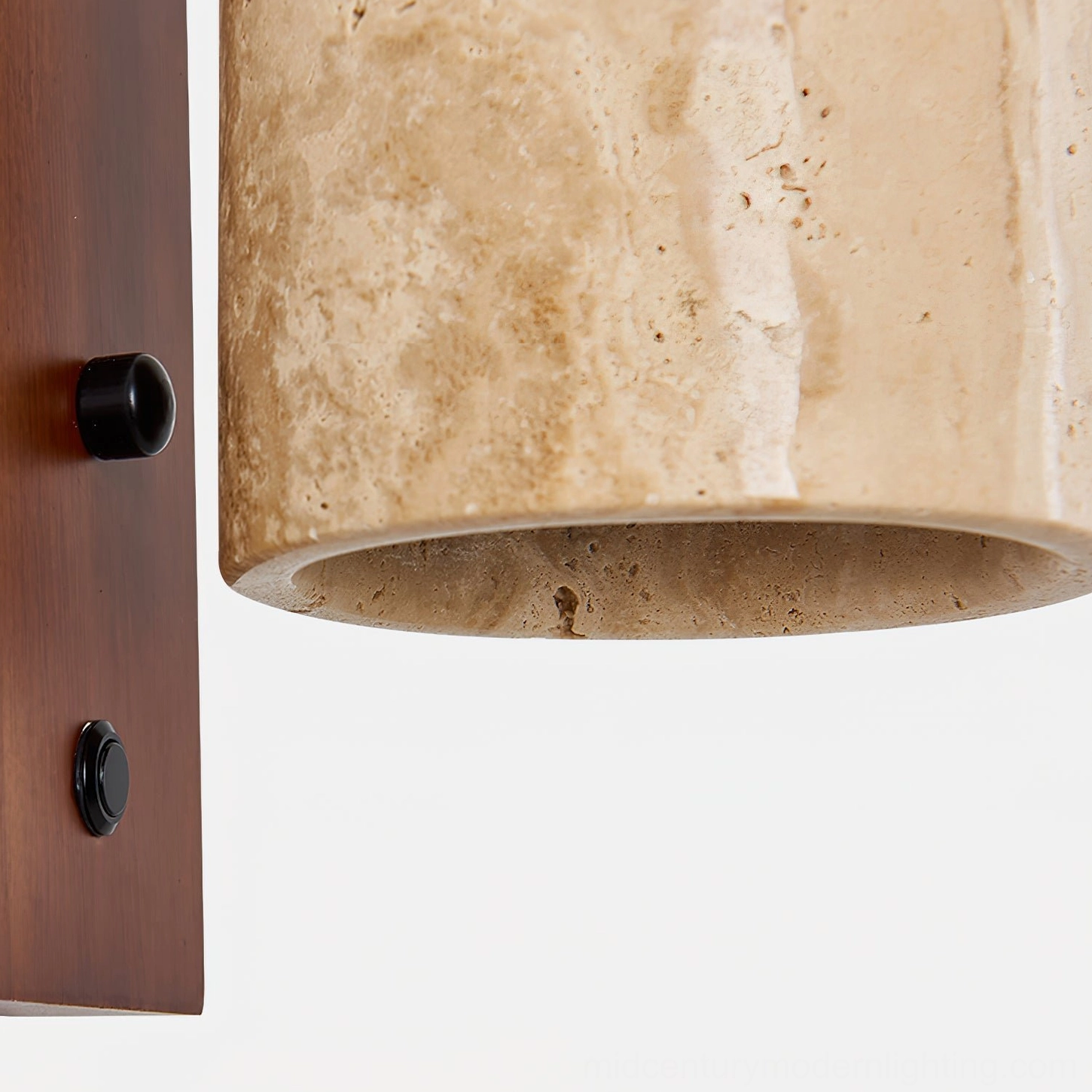 Close-up of Tersus wall sconce travertine shade showing natural stone pores and honeycomb texture