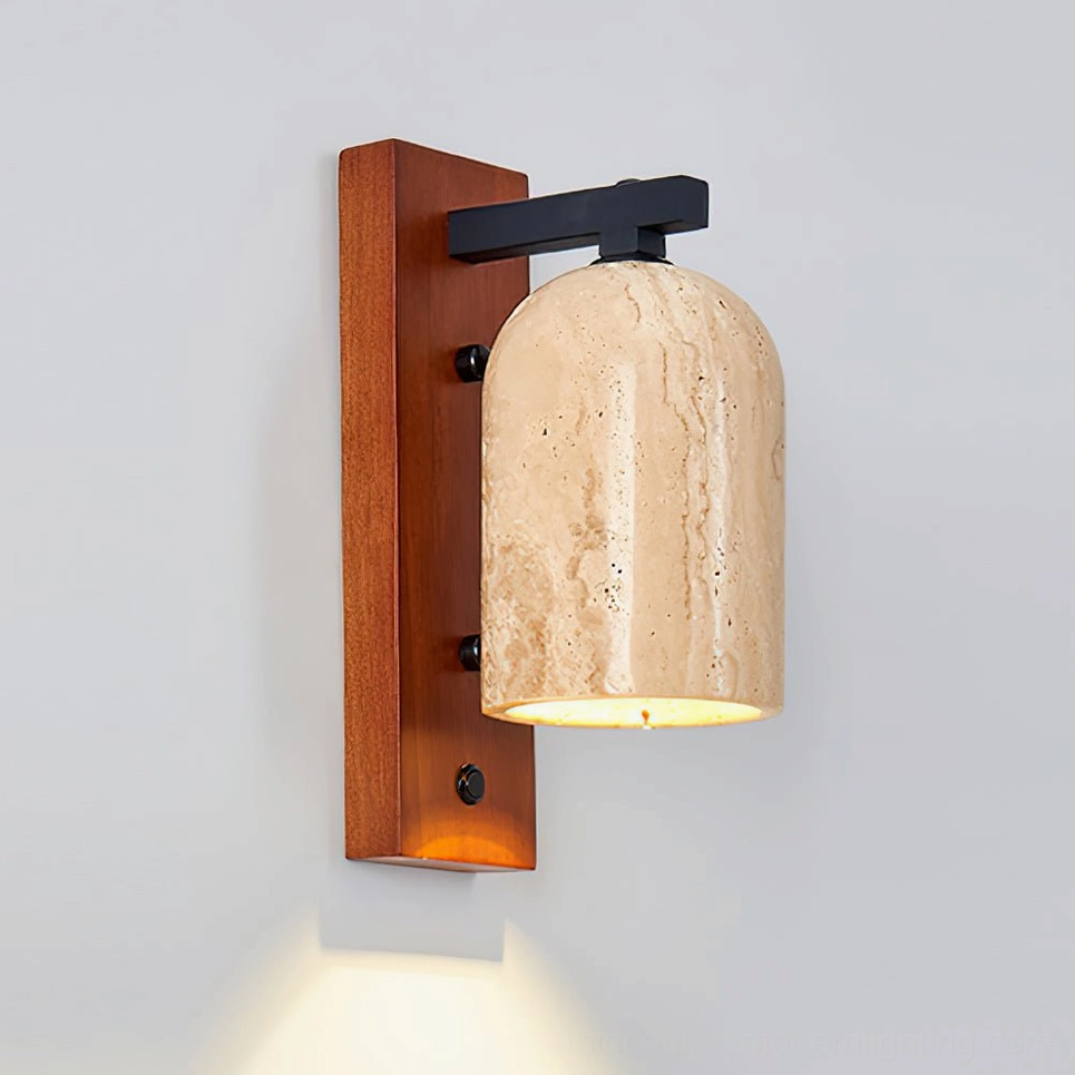Tersus wall sconce mounted on off-white wall with warm LED light illuminating natural travertine texture