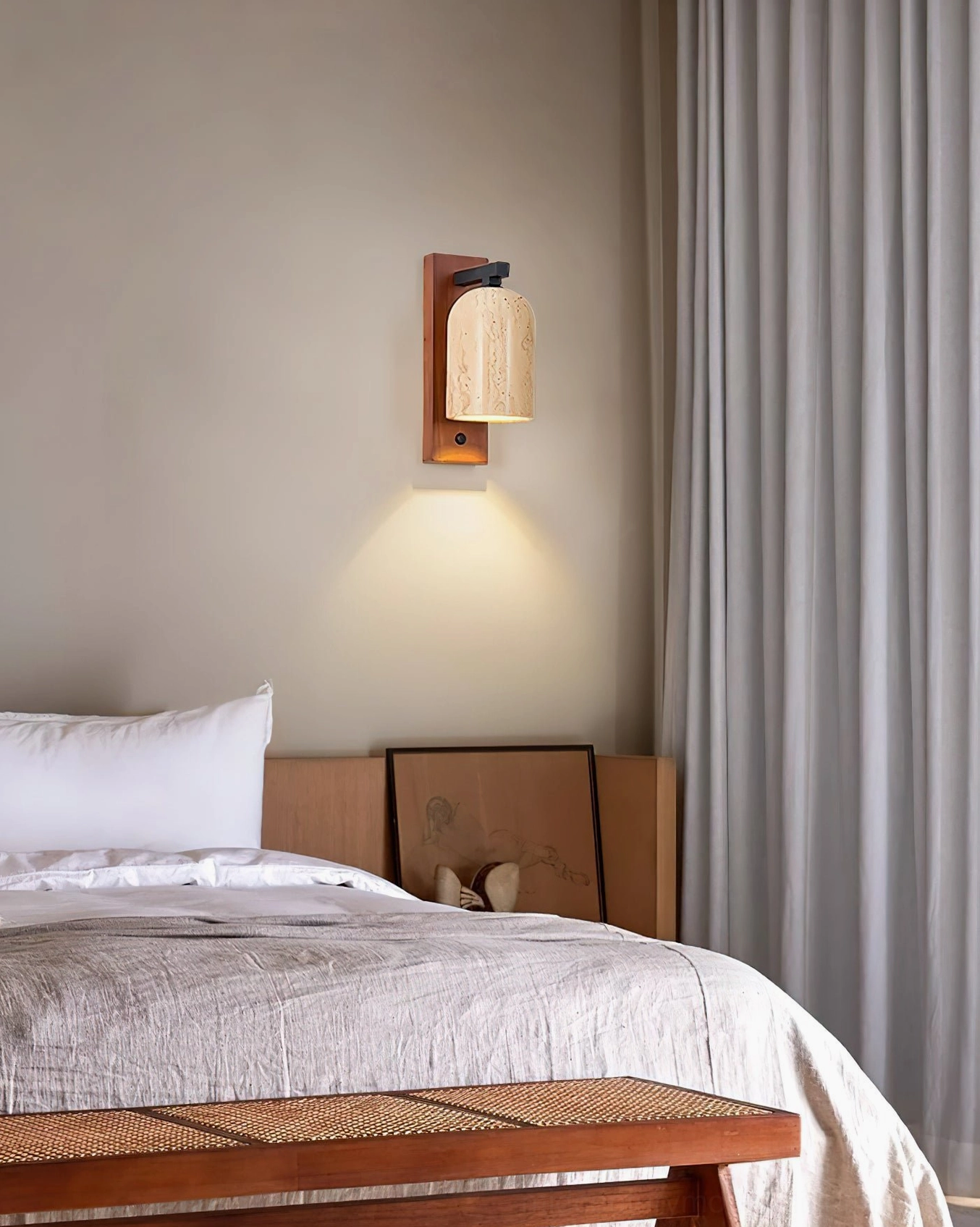 Tersus travertine wall light in minimalist bedroom with soft diffused glow