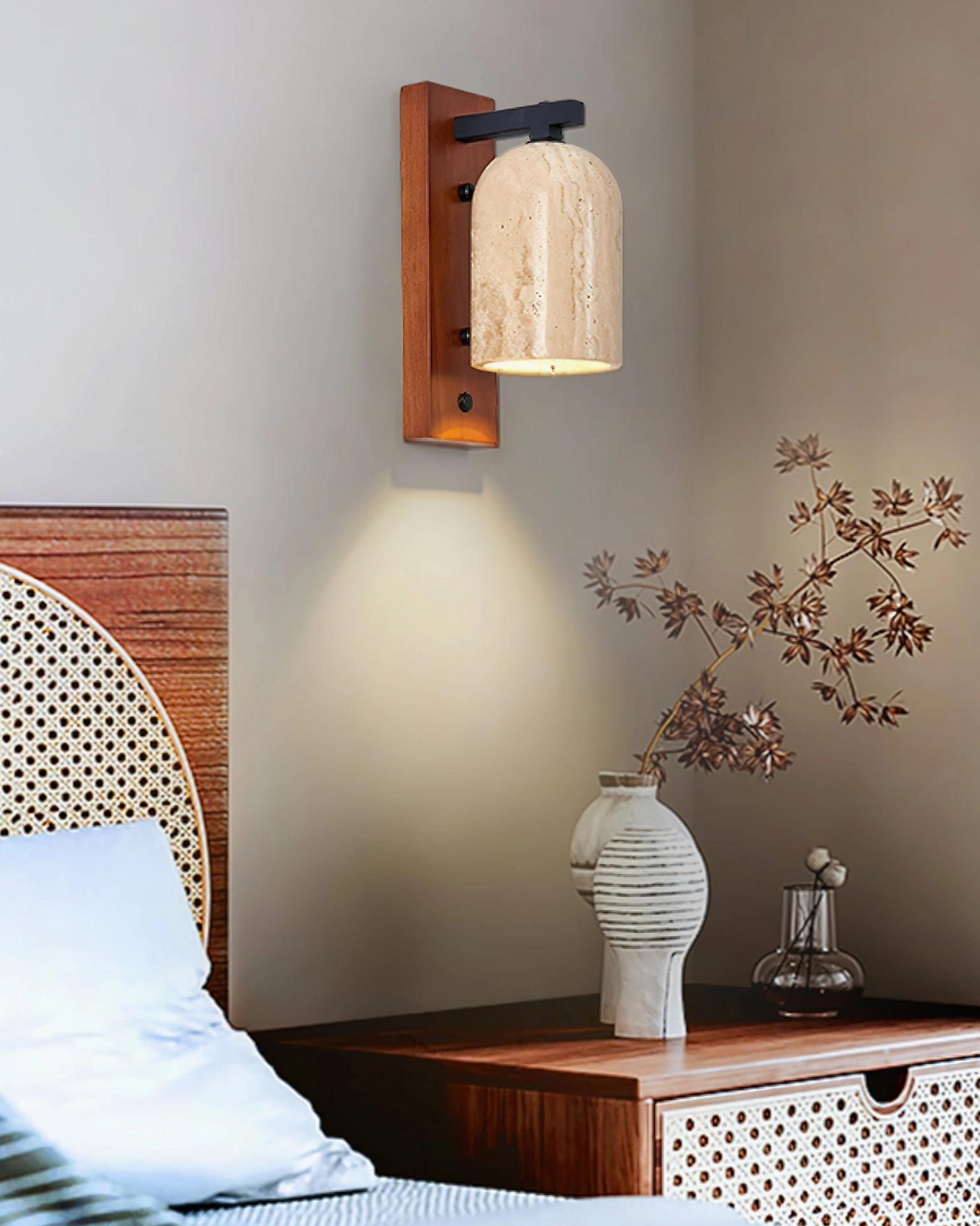 Tersus travertine wall sconce in rustic bedroom providing warm ambient bedside lighting