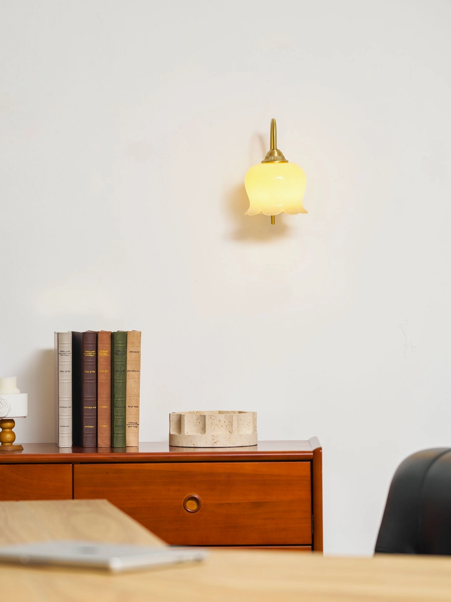 Mid-century modern lily of the valley wall lamp mounted on textured wall with ambient lighting