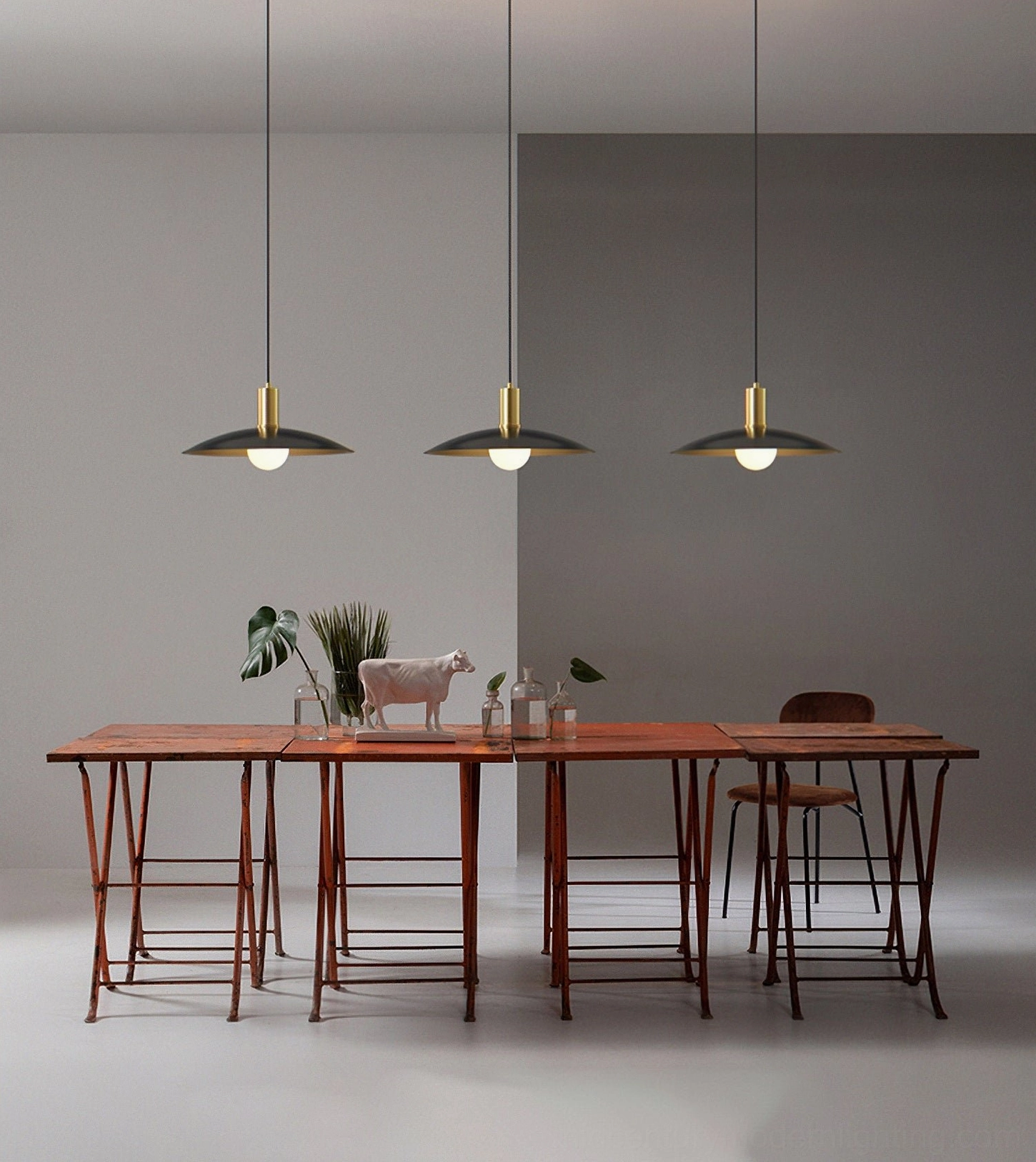 Three Aplomb pendants over modern dining room with wooden furniture, warm luxury design