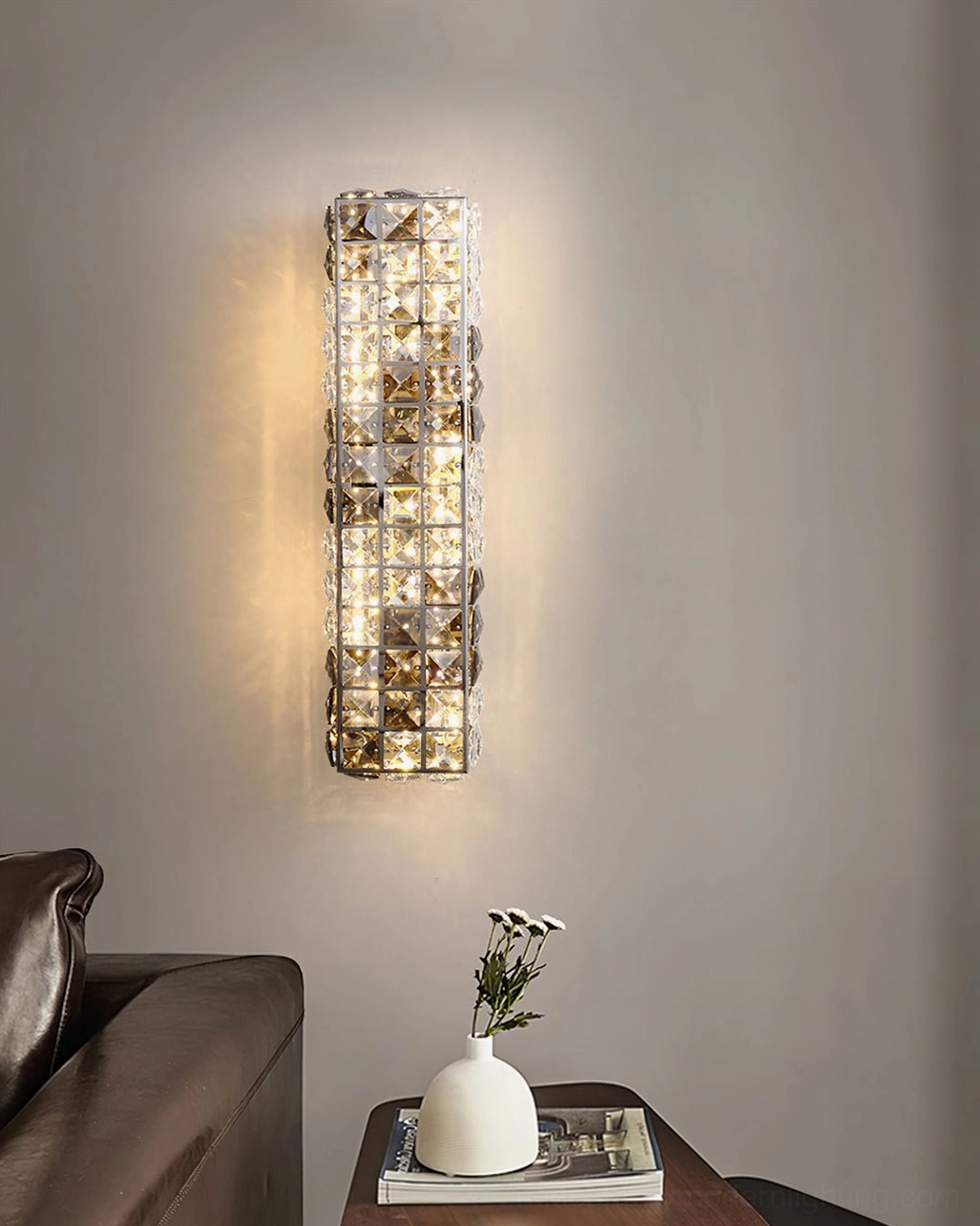Icycle wall sconce with three-color changing LED technology displaying warm white illumination