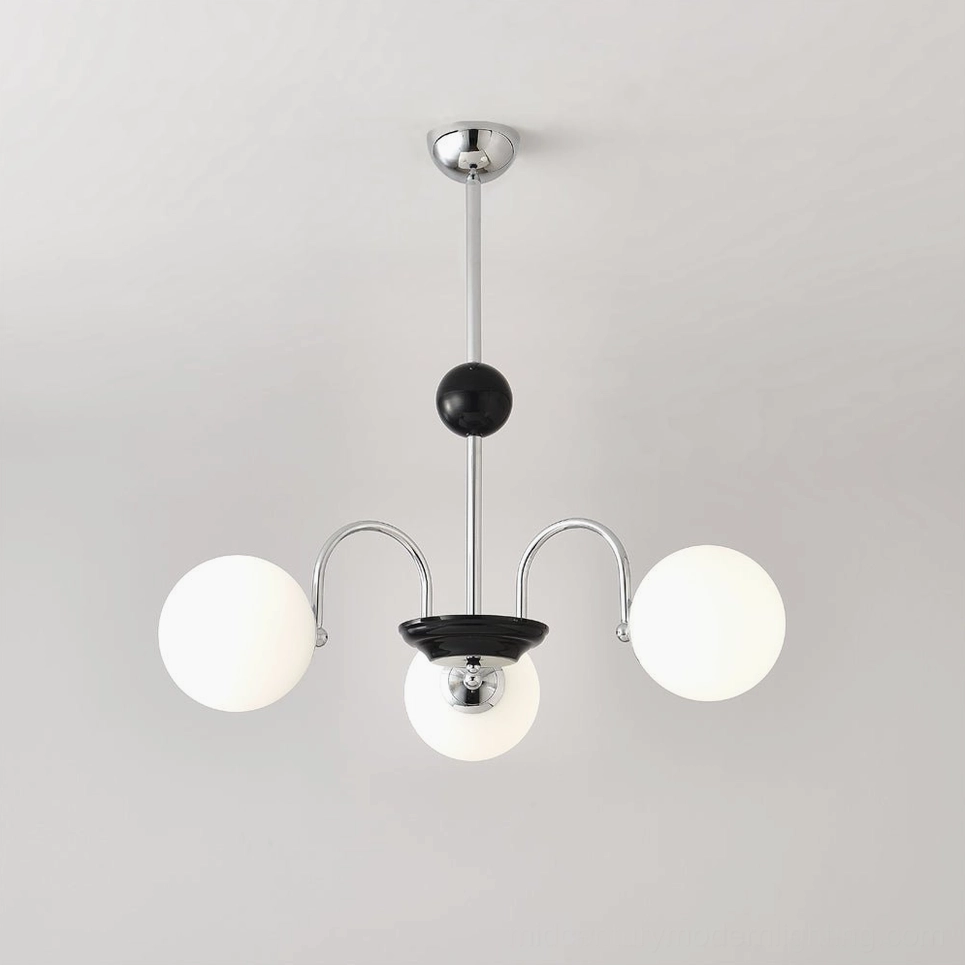 Three-head globe chandelier with chrome-black frame in minimalist residential setting