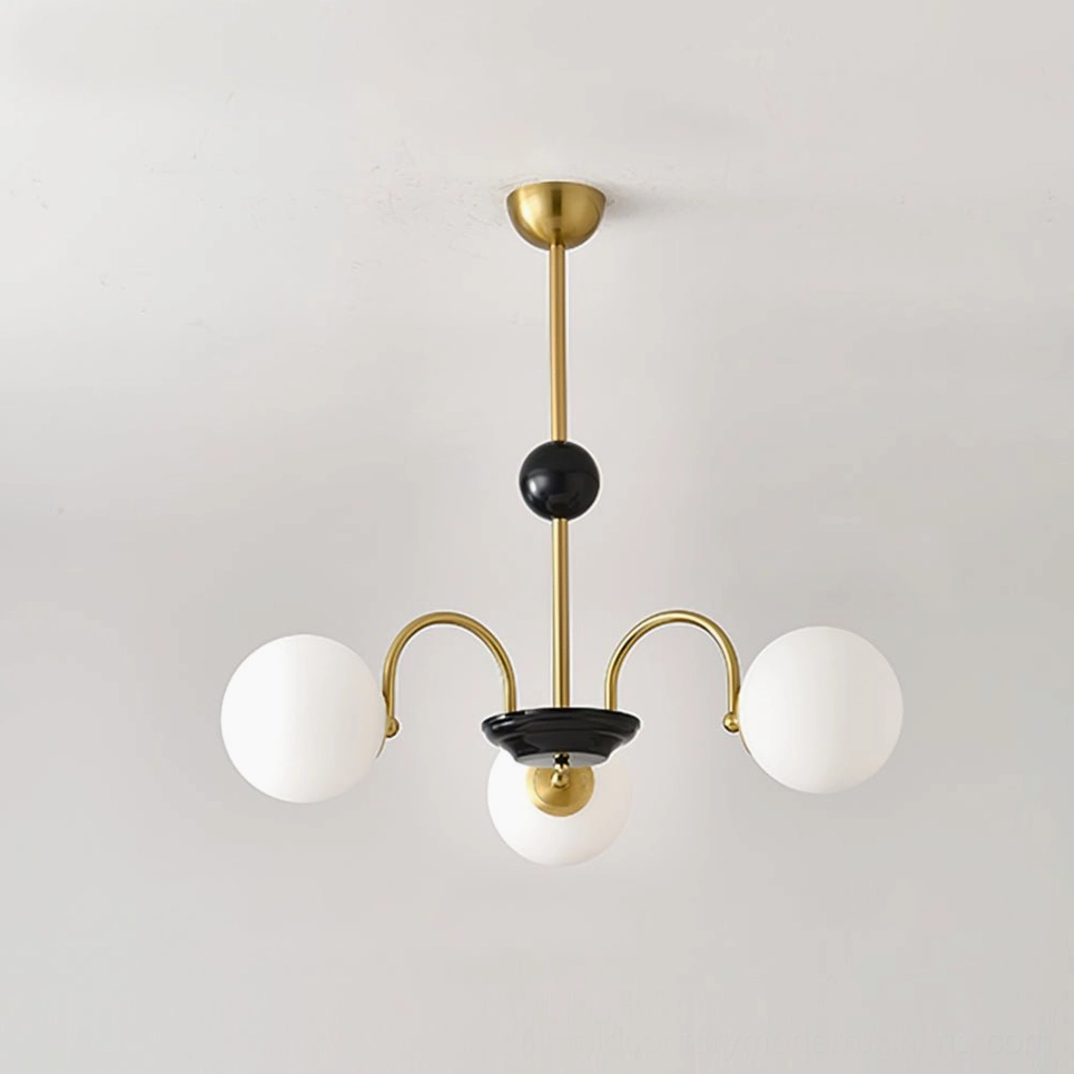 Three-head globe chandelier with gold-black frame and frosted white glass globes