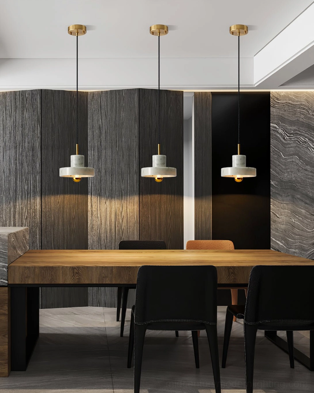 Set of three matching white marble pendant lamps clustered above formal dining table in luxury minimalist home