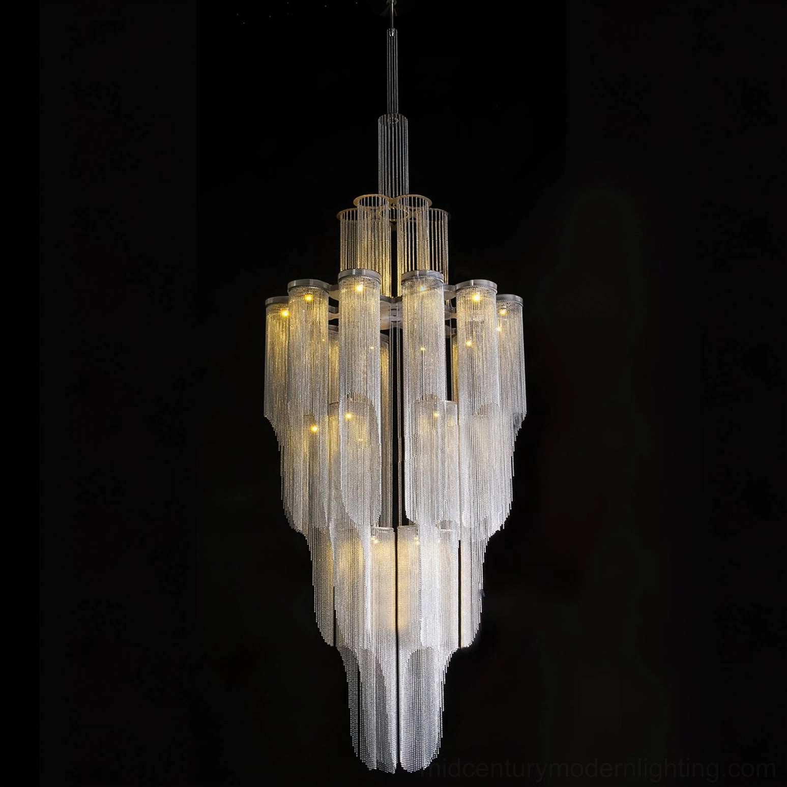 Modern tiered crystal chandelier with dark frame - studio product photography with black backdrop