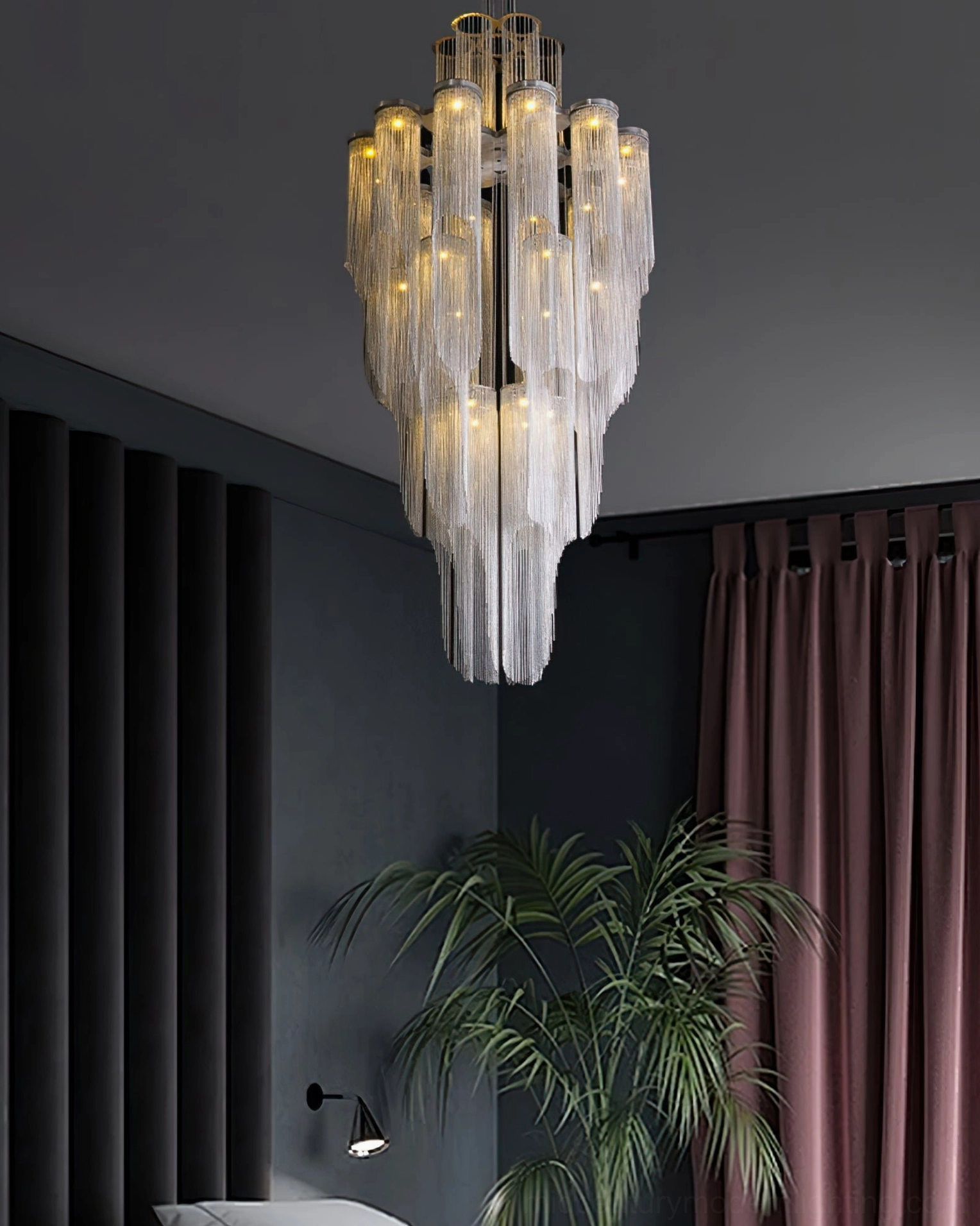 Tiered crystal chandelier installed in spacious foyer with elegant minimalist décor