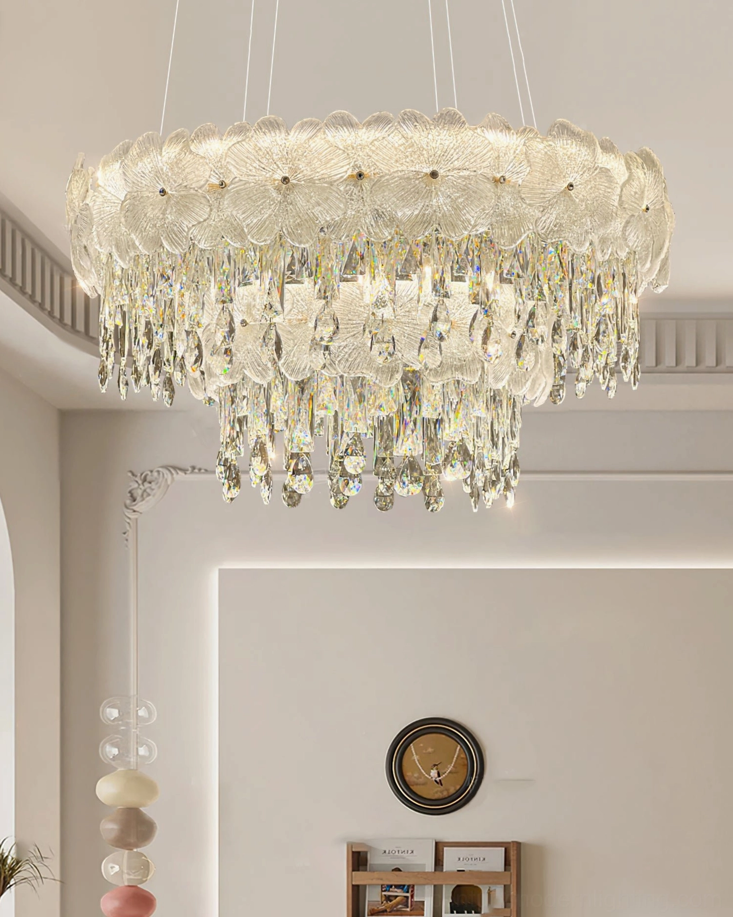 Tiered crystal chandelier low angle view modern living room golden stainless steel frame hanging crystals warm lighting