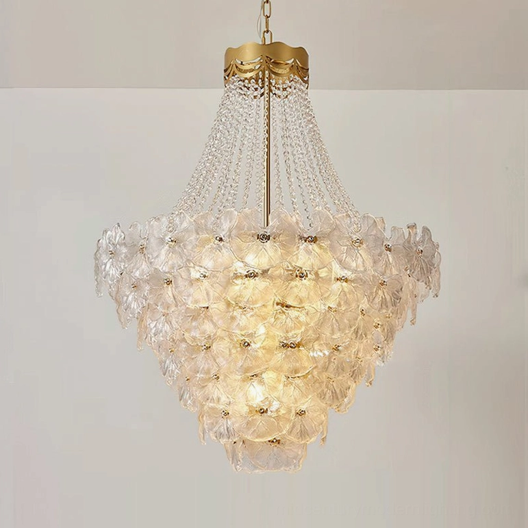 Three-quarter front view of tiered crystal chandelier with prominent crystal bead trim and wide silhouette