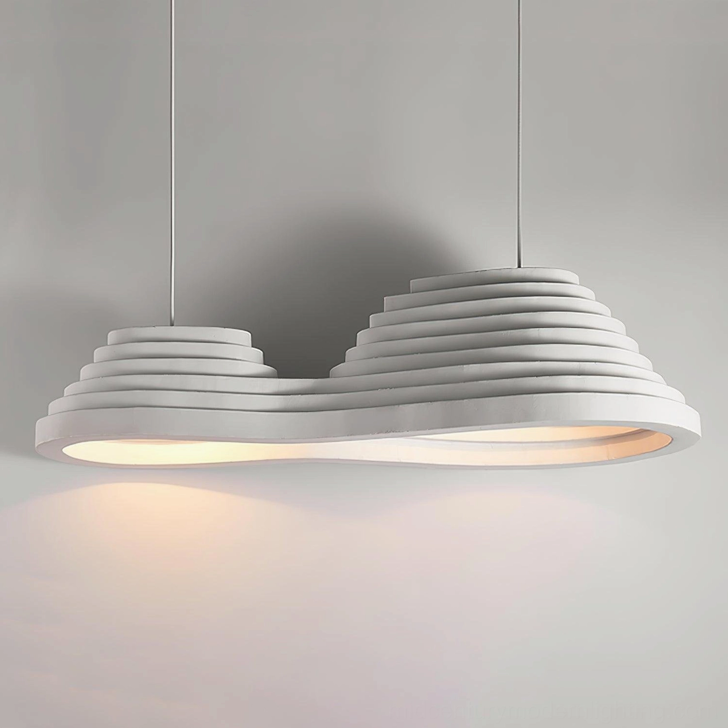 Three-quarter perspective view of organic tiered pendant showing sculptural depth and layered formation