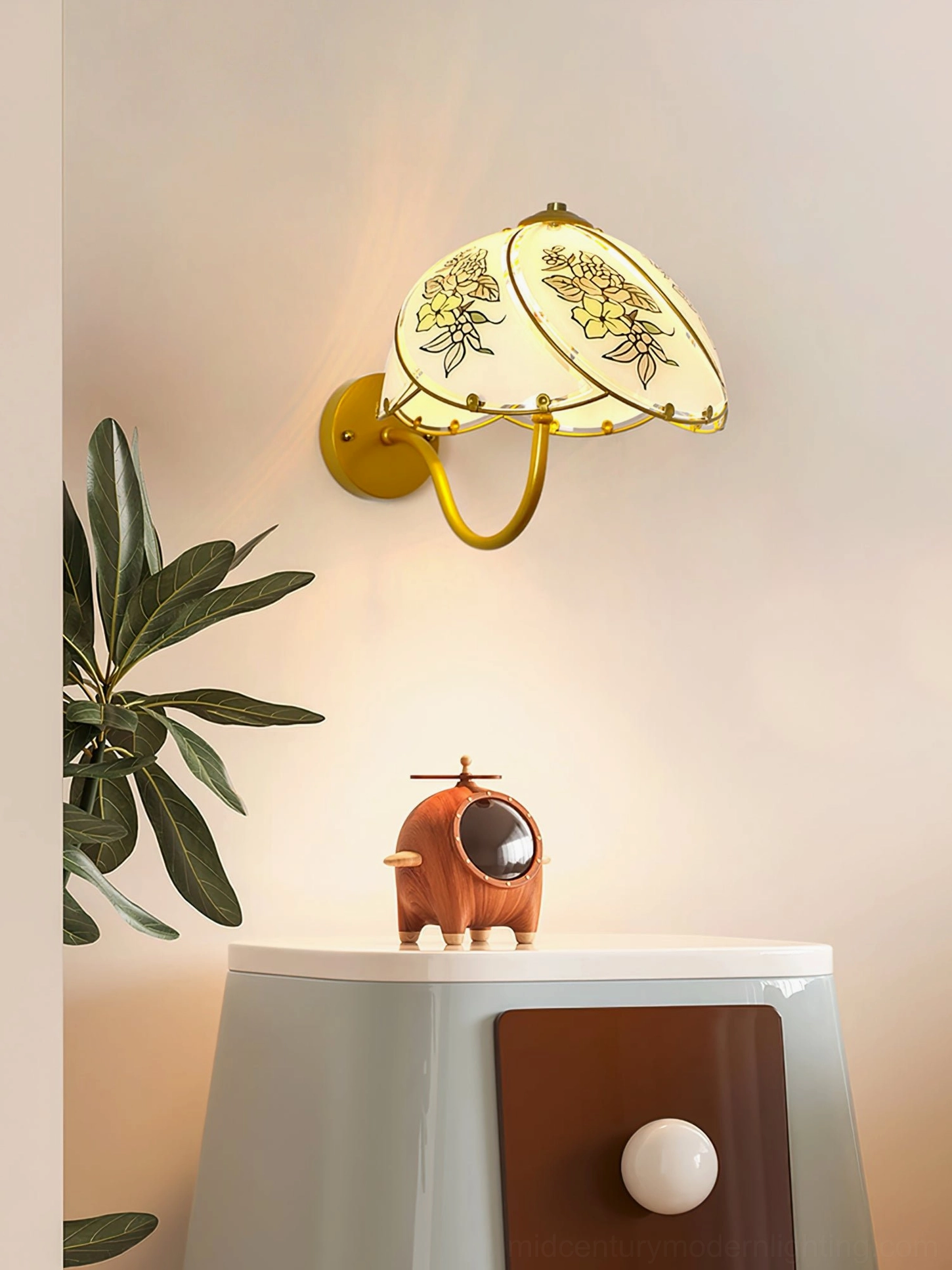 Tiffany Lily Wall Sconce mounted above side table with decorative accessories and foliage