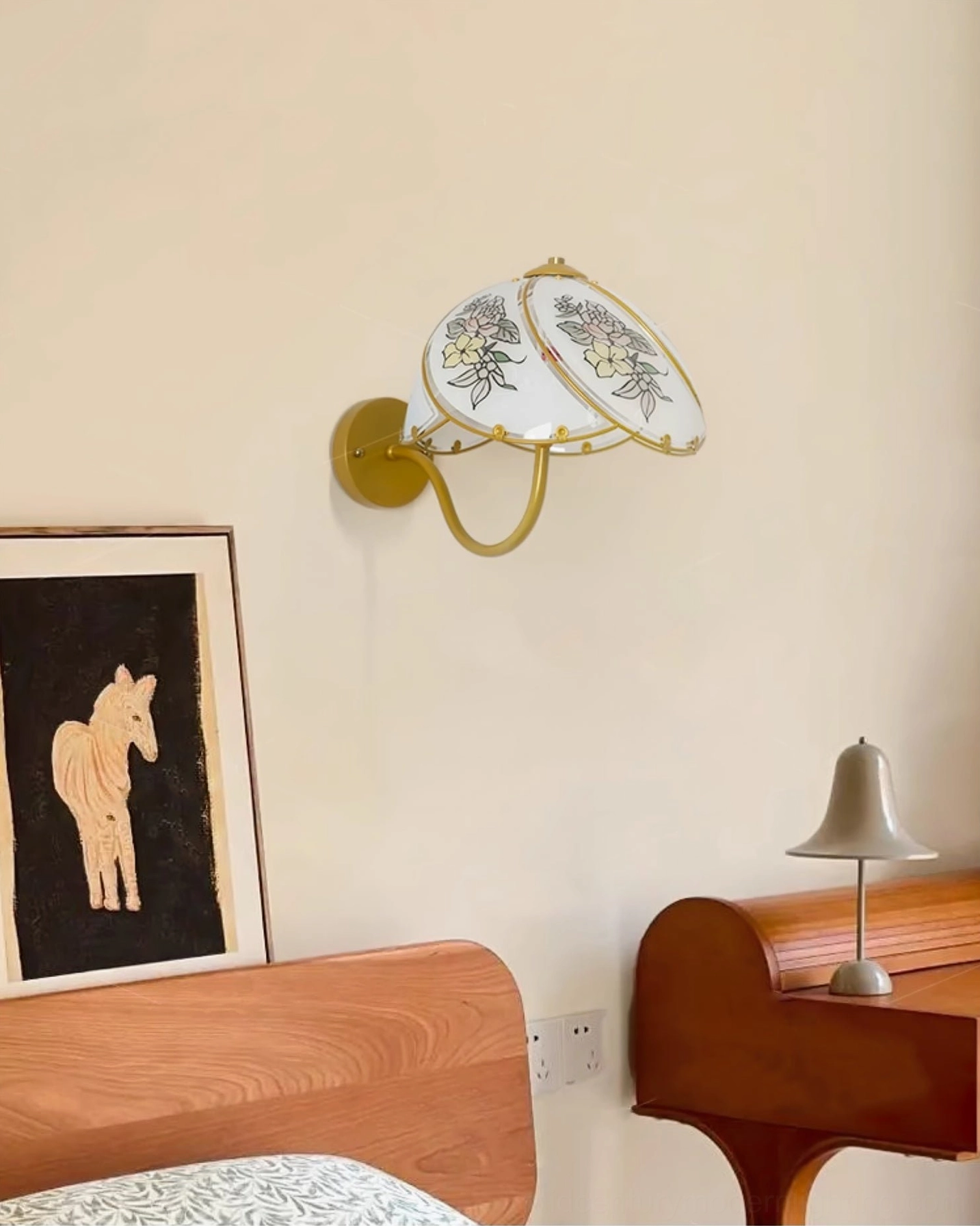Tiffany Lily Wall Sconce in bedroom vanity area with art print and warm vintage ambiance
