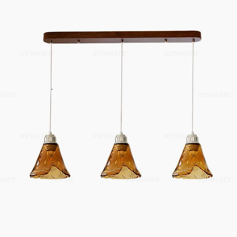 Tiro 3-head linear glass pendant light arrangement showing multiple hand-blown amber shades with chrome metalwork