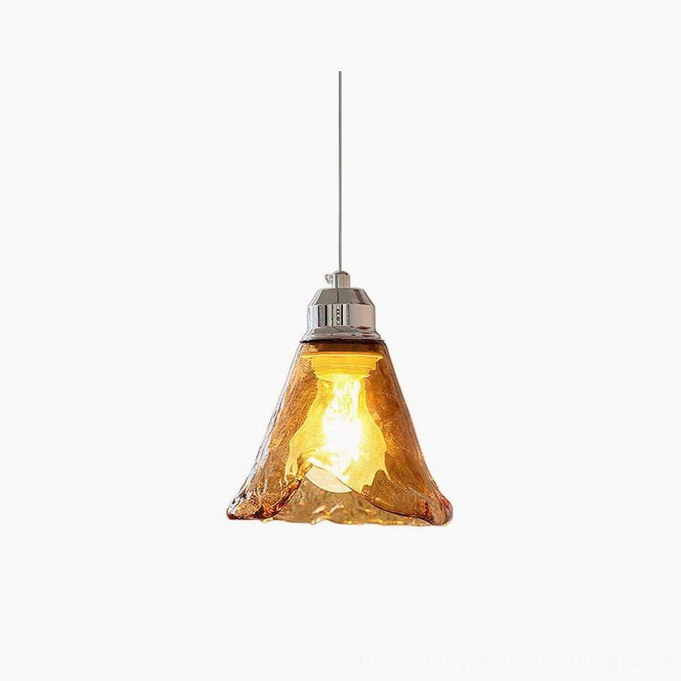 Tiro amber glass pendant light with hand-blown wavy shade and chrome metal fixture, front studio view against white background