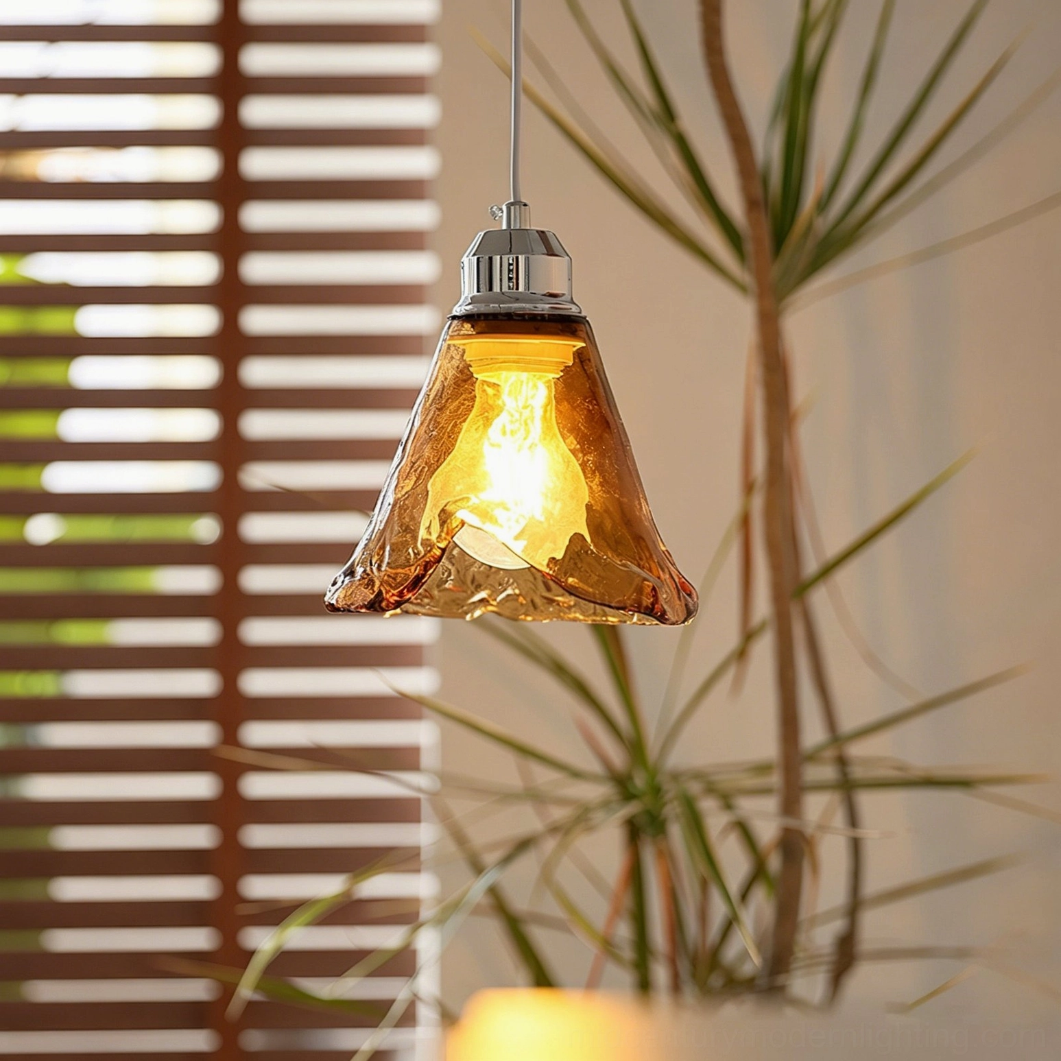 Tiro pendant light installed in mid-century modern interior with warm glow from vintage Edison bulb, side angle with louver window