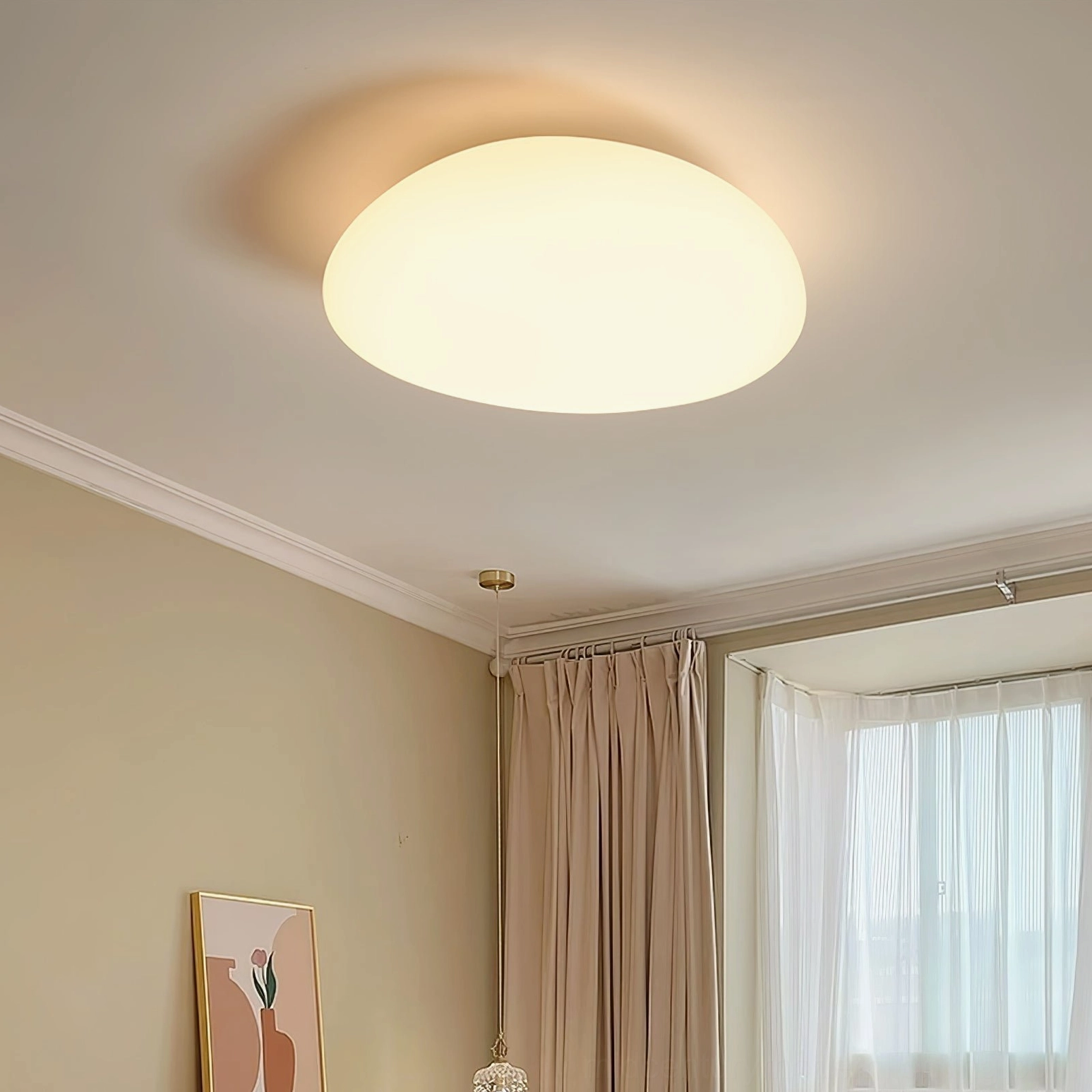 Toan LED ceiling light installed in modern minimalist bedroom, creating ambient warm lighting above bed