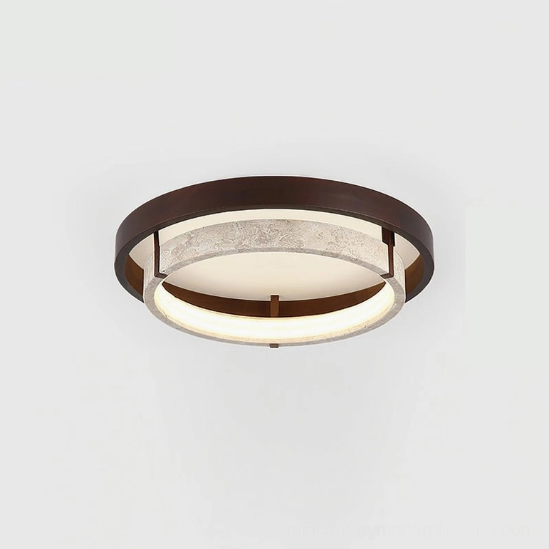 Close-up front view of Menine ceiling light showing layered ring design and warm LED edge lighting