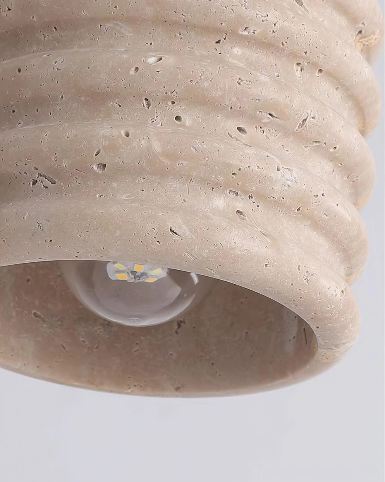 Travertine ceiling lamp in bohemian warm aesthetic home interior setting