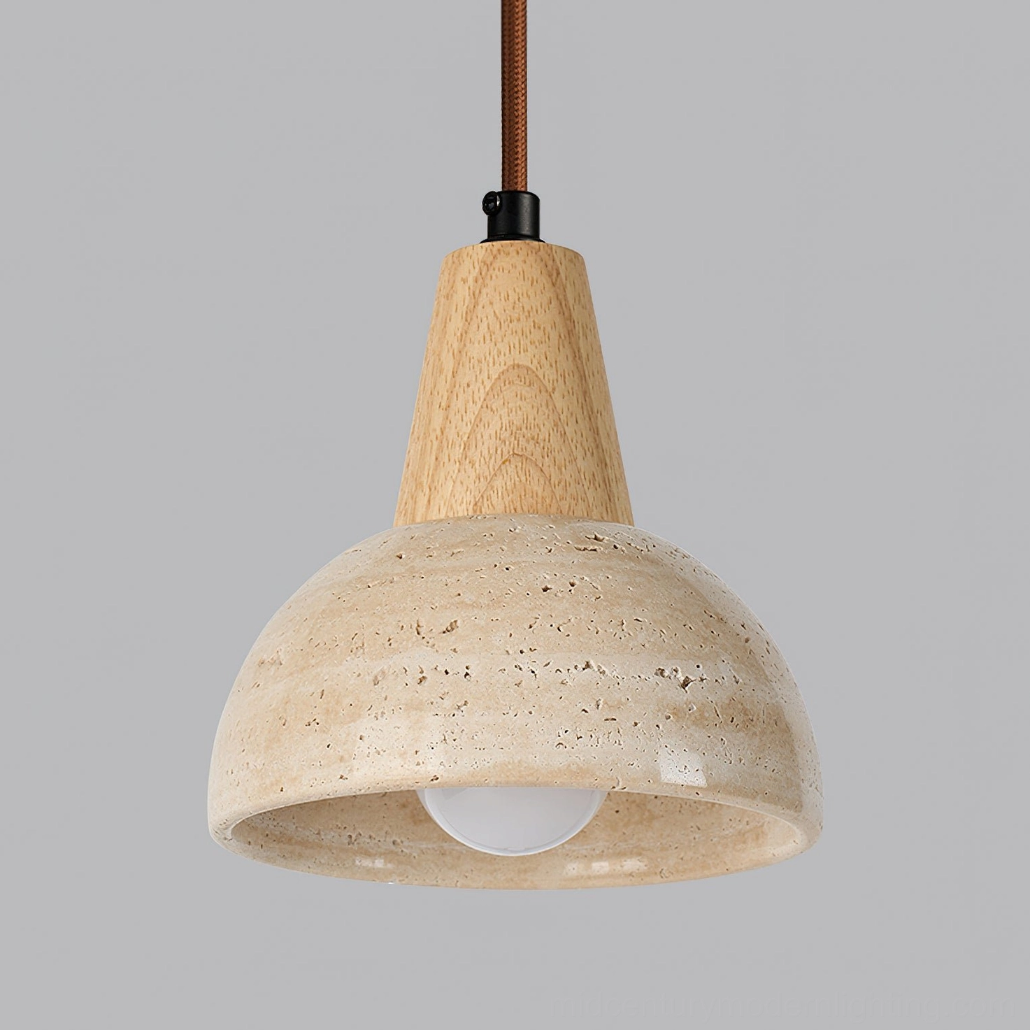 Close-up side view of travertine pendant lamp showing natural porous stone texture and wood trim details