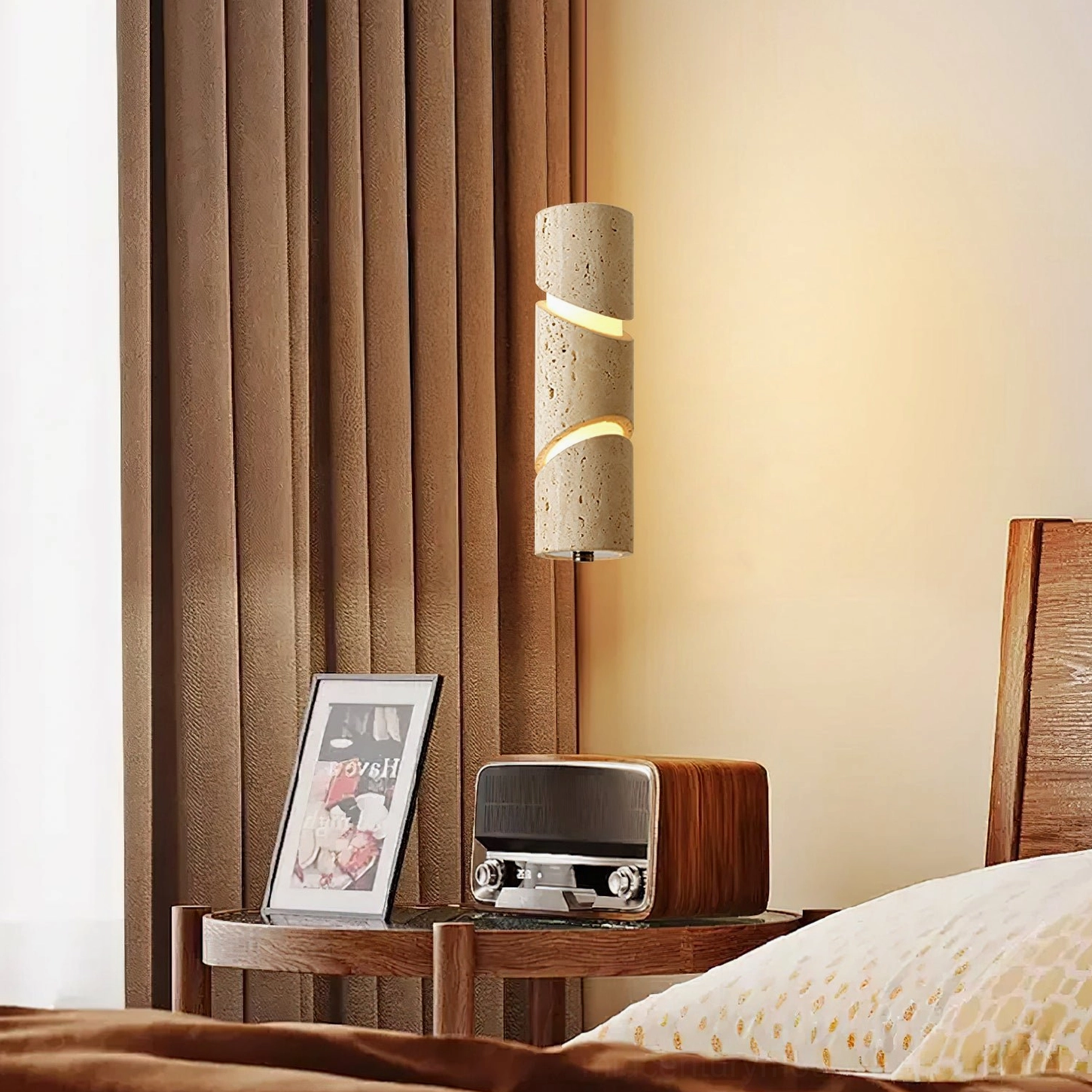 Side view of travertine sculptural pendant lamp in contemporary bedroom interior with natural bedside styling