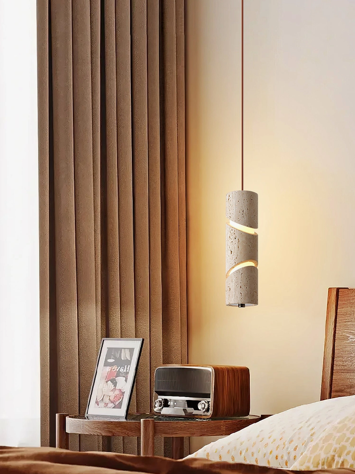 Travertine sculptural pendant lamp in vintage bedroom setting with warm brown curtains and rustic decor