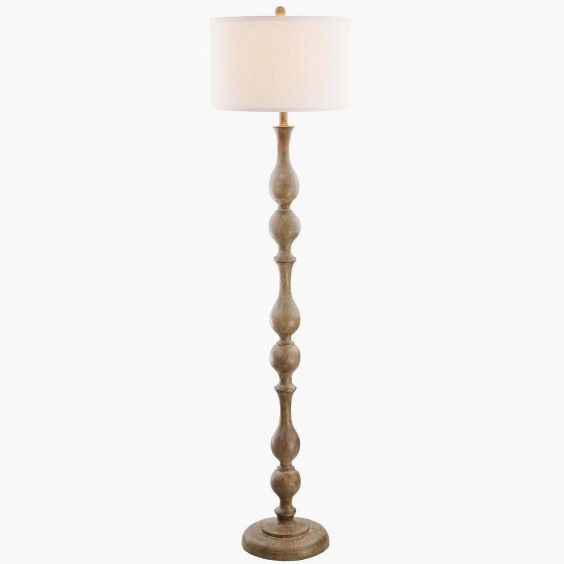 Tremblay turned wood floor lamp with warm soft lighting on shade, studio view emphasizing fabric texture and warm tones