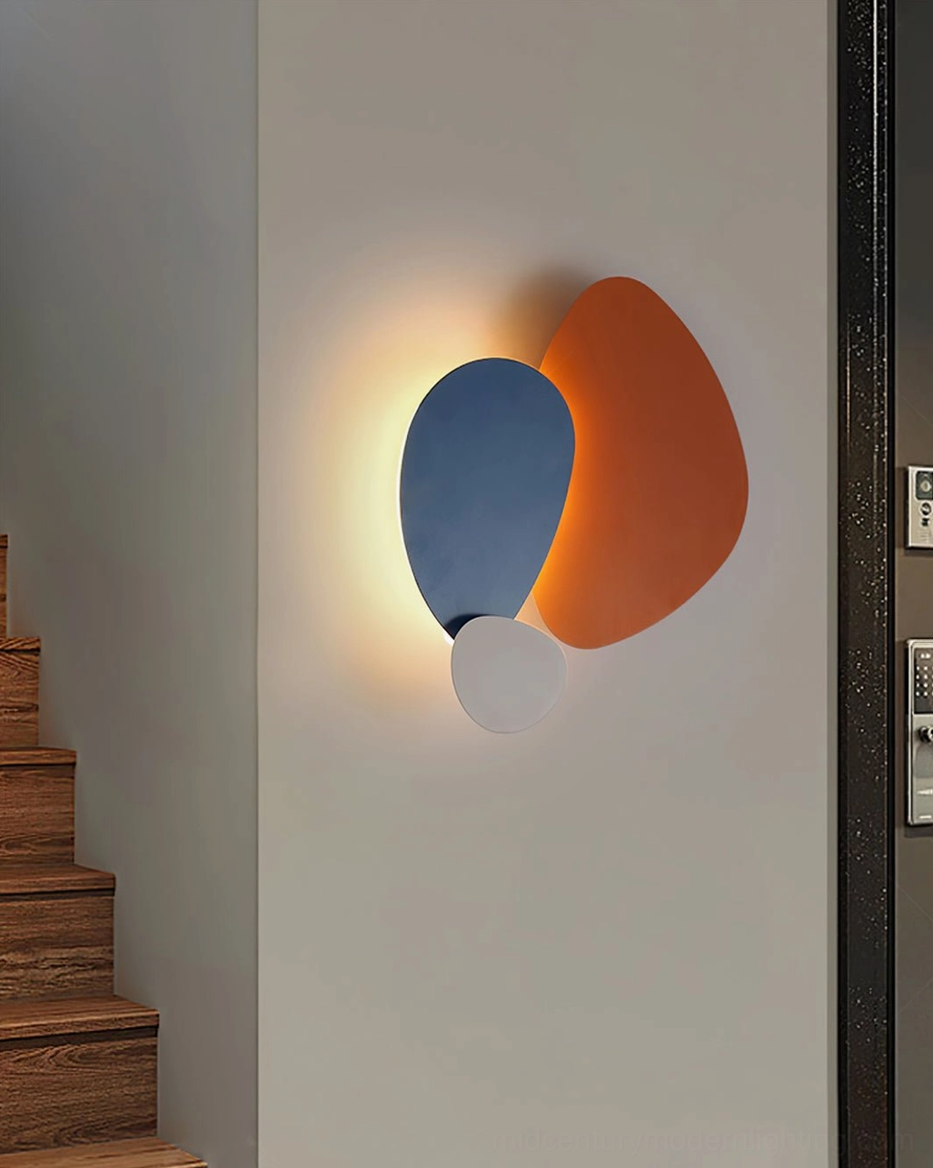Tria navy blue and orange LED wall lamp with curved design in apartment entrance creating ambient backlight
