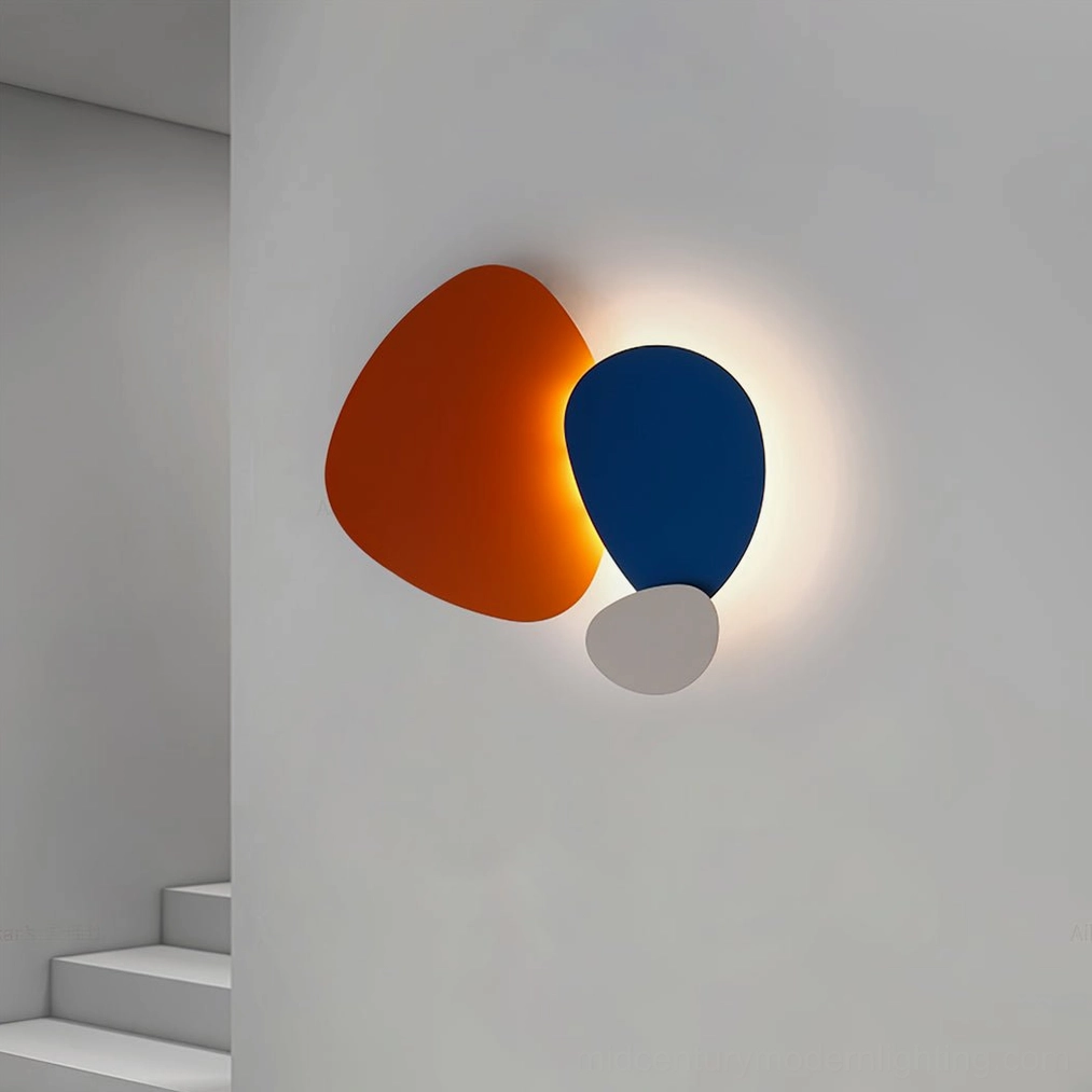 Tria contemporary wall lamp with geometric form installed on stairwell wall with modern ambient lighting