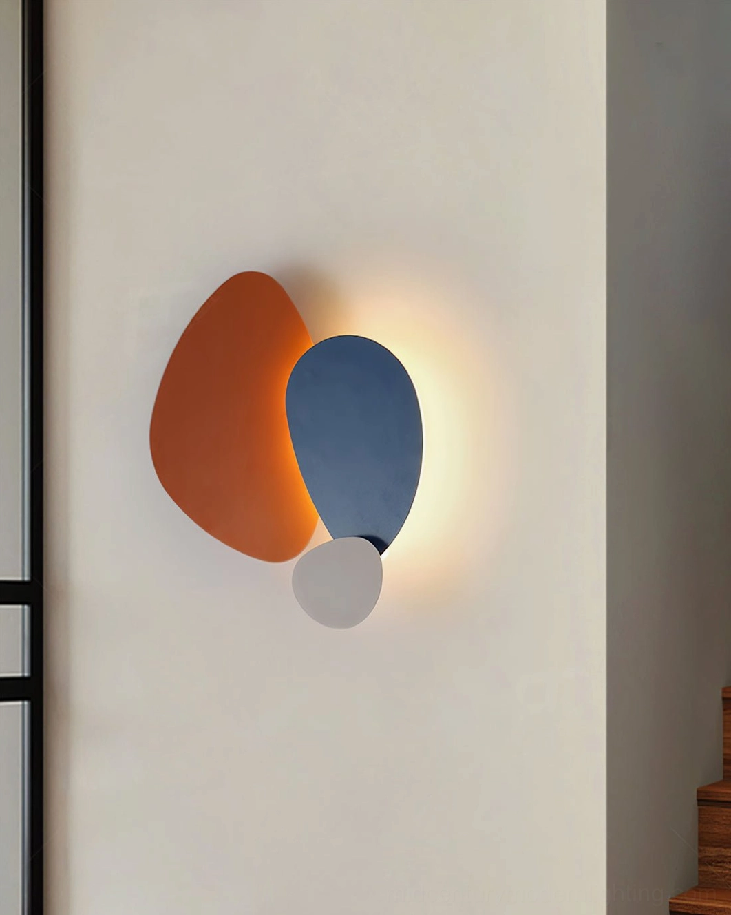Tria modular LED wall lamp installed as accent piece in modern hospitality environment