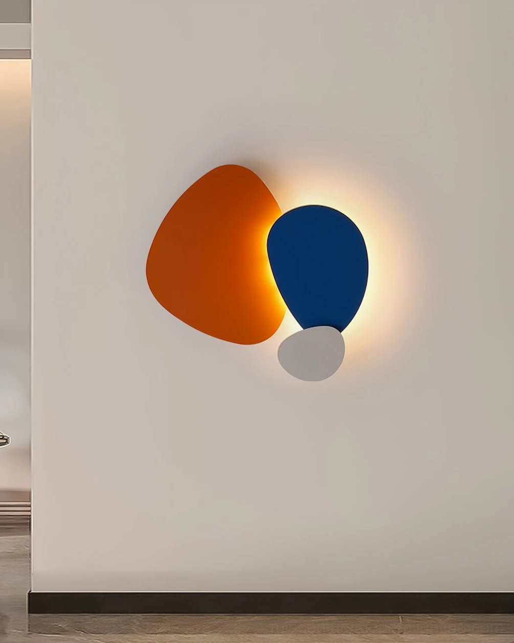 Tria wall lamp with contemporary geometric form creating sophisticated spatial focal point
