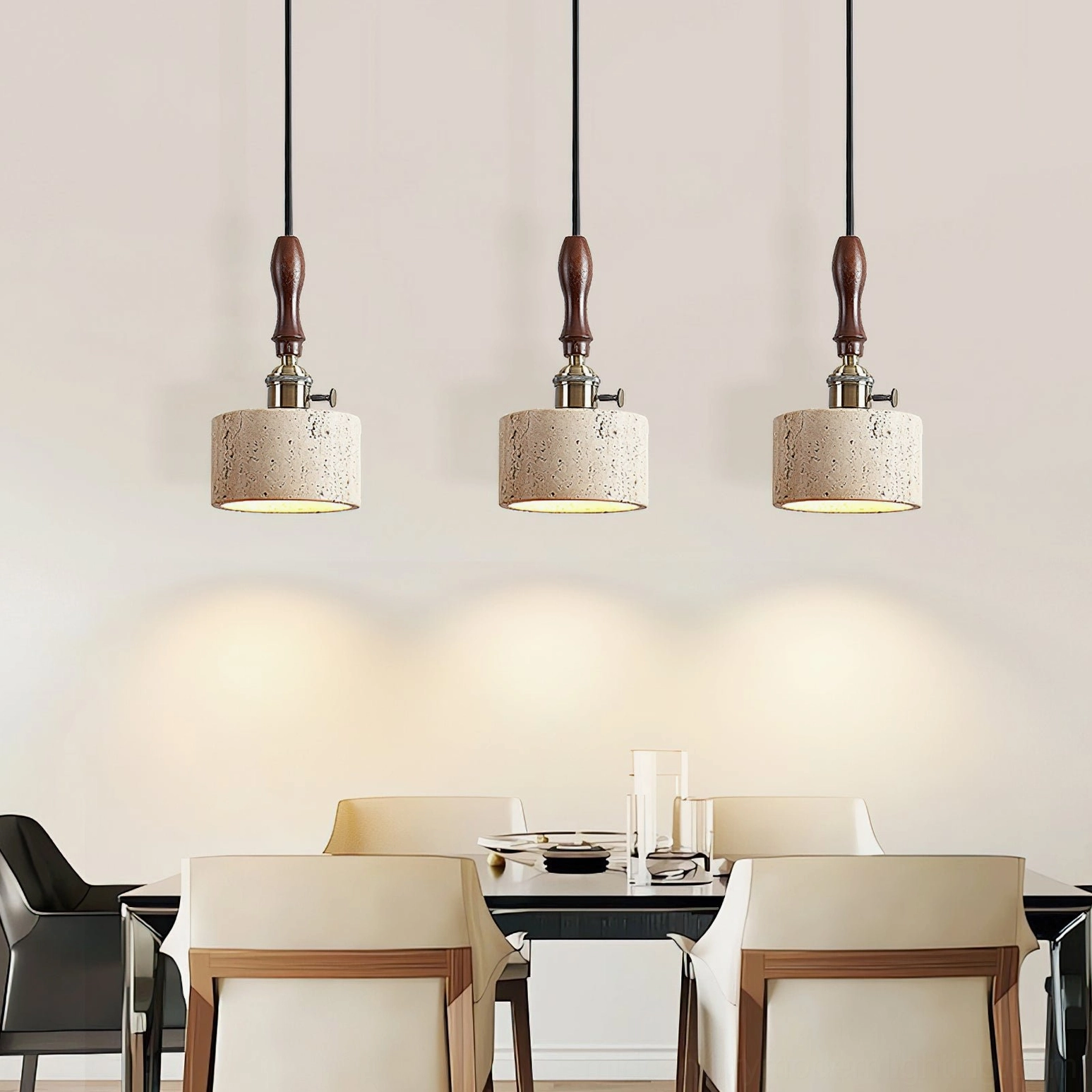 Triple travertine pendant lights clustered in dining room creating matching rustic lighting installation