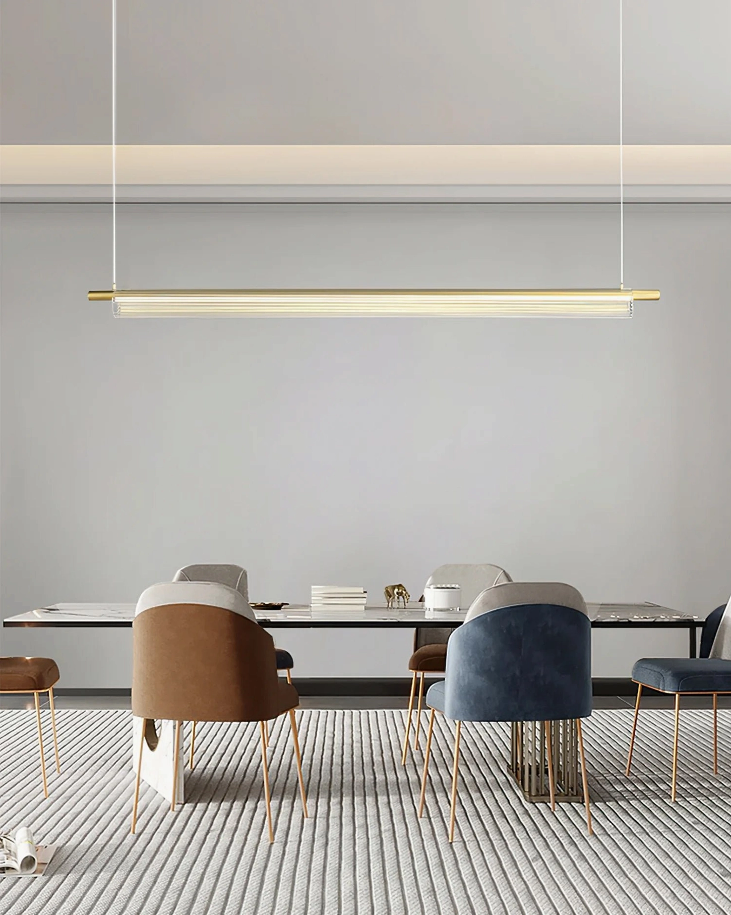 Trisel linear pendant light in brushed gold finish, formal upscale dining room with luxury modern aesthetic