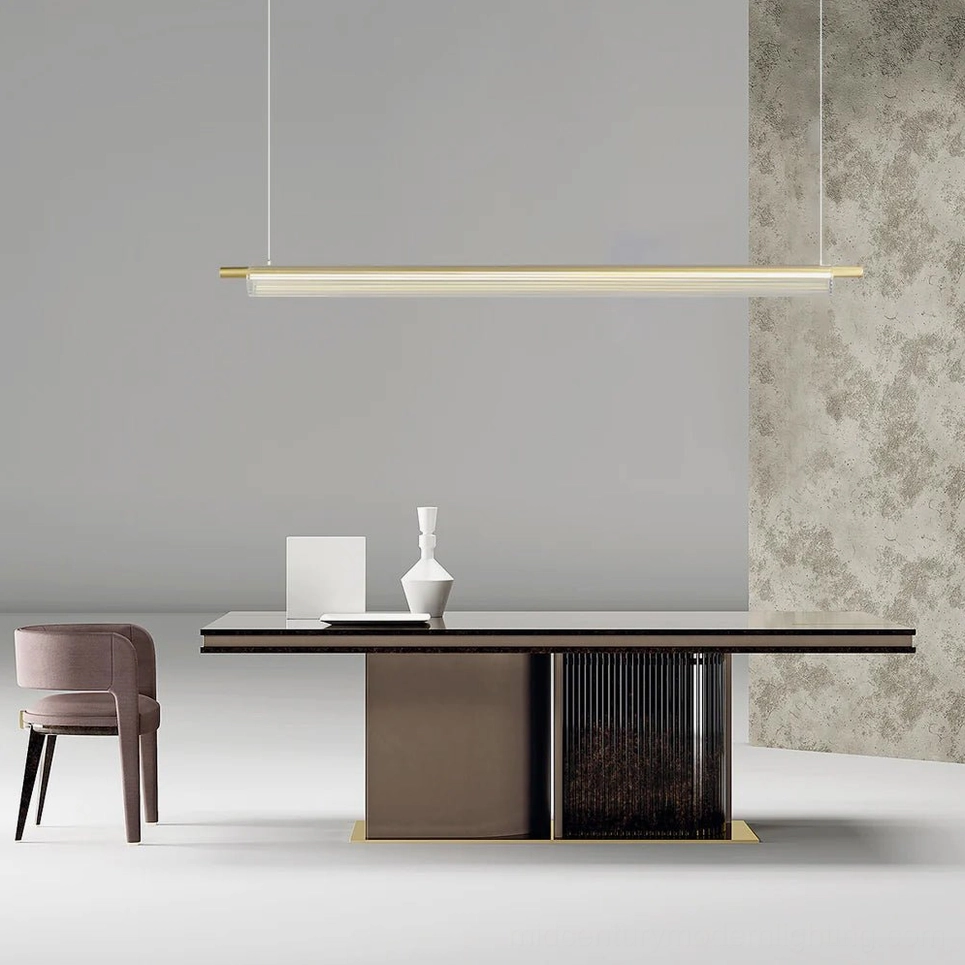 Trisel brass gold pendant lamp in upscale dining space with textured accent wall, side view perspective