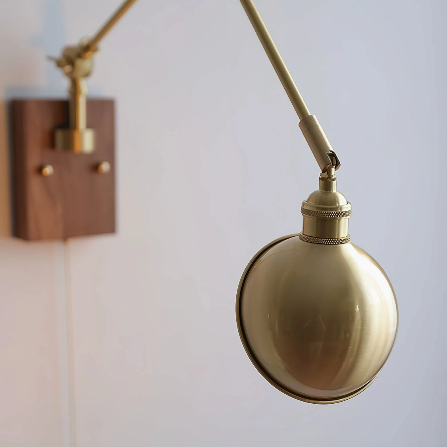 Troy Swing Arm Wall Lamp close-up walnut wall plate brass spherical shade adjustable joint
